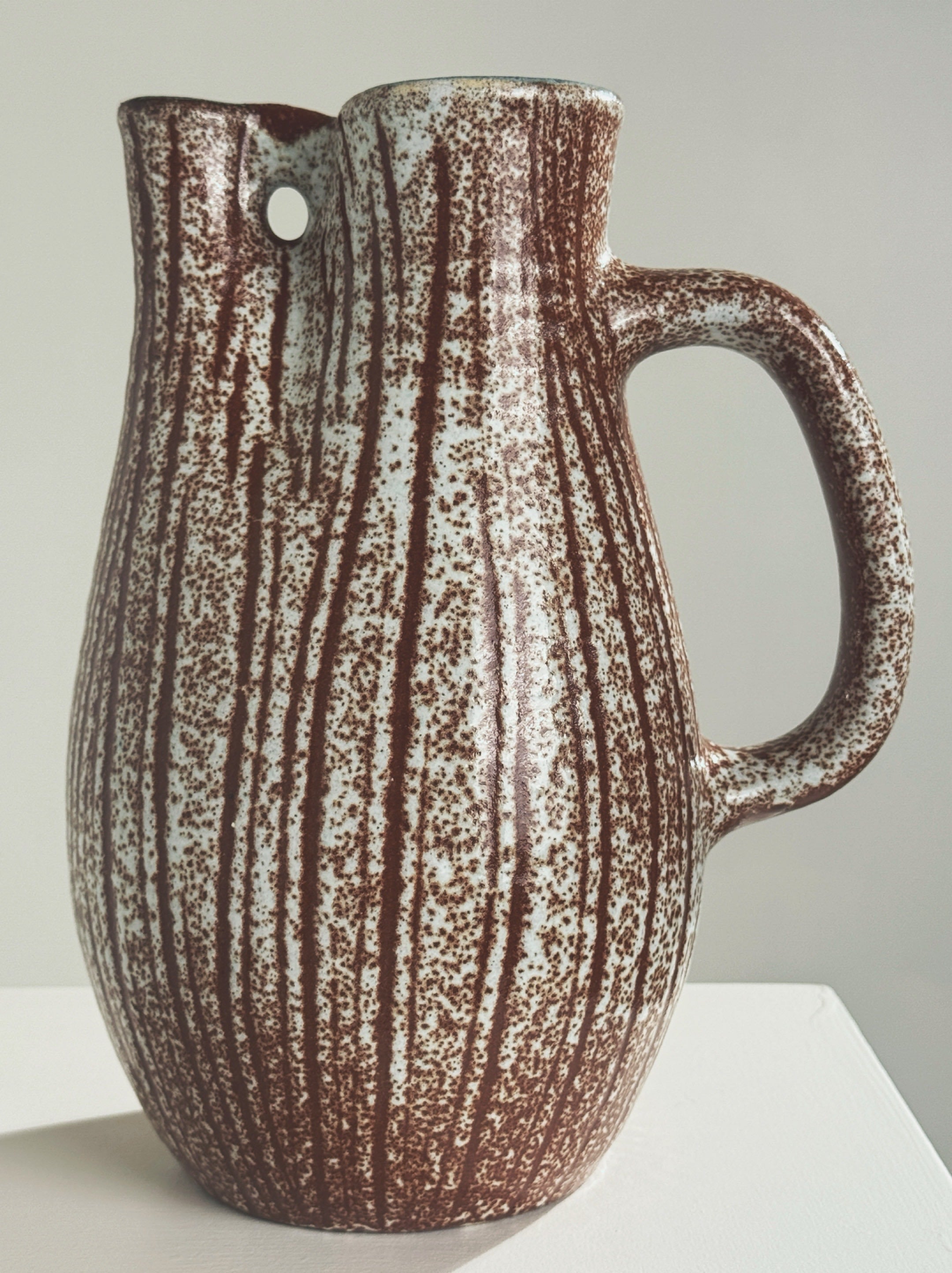 Zoomorphic Pitcher by the Accolay potters — side angle showing speckled ceramic texture