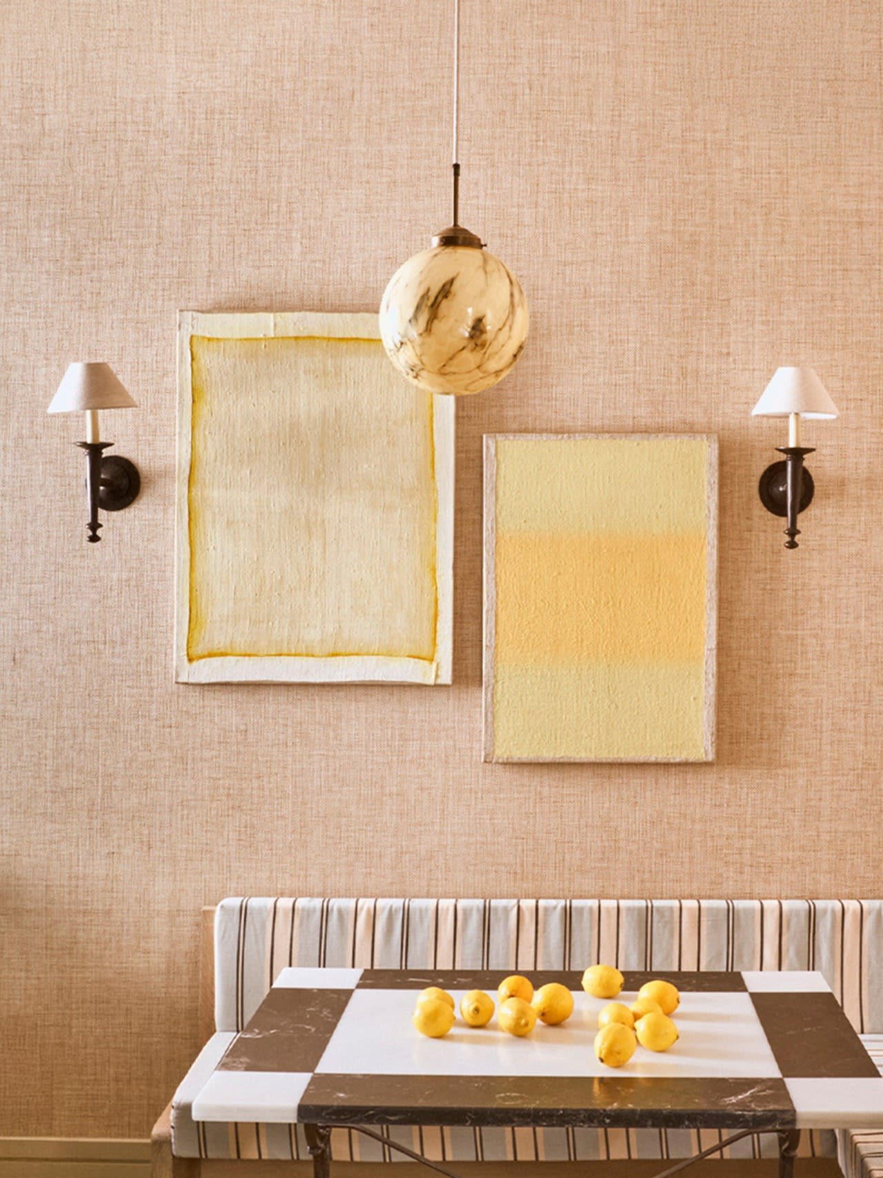 Hand-Torch Wall Light — mounted on textured wall beside artwork