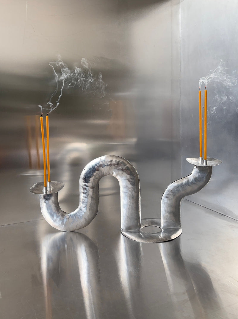 Phaedra Candle Holder Table — close-up of twisted metal design with candles