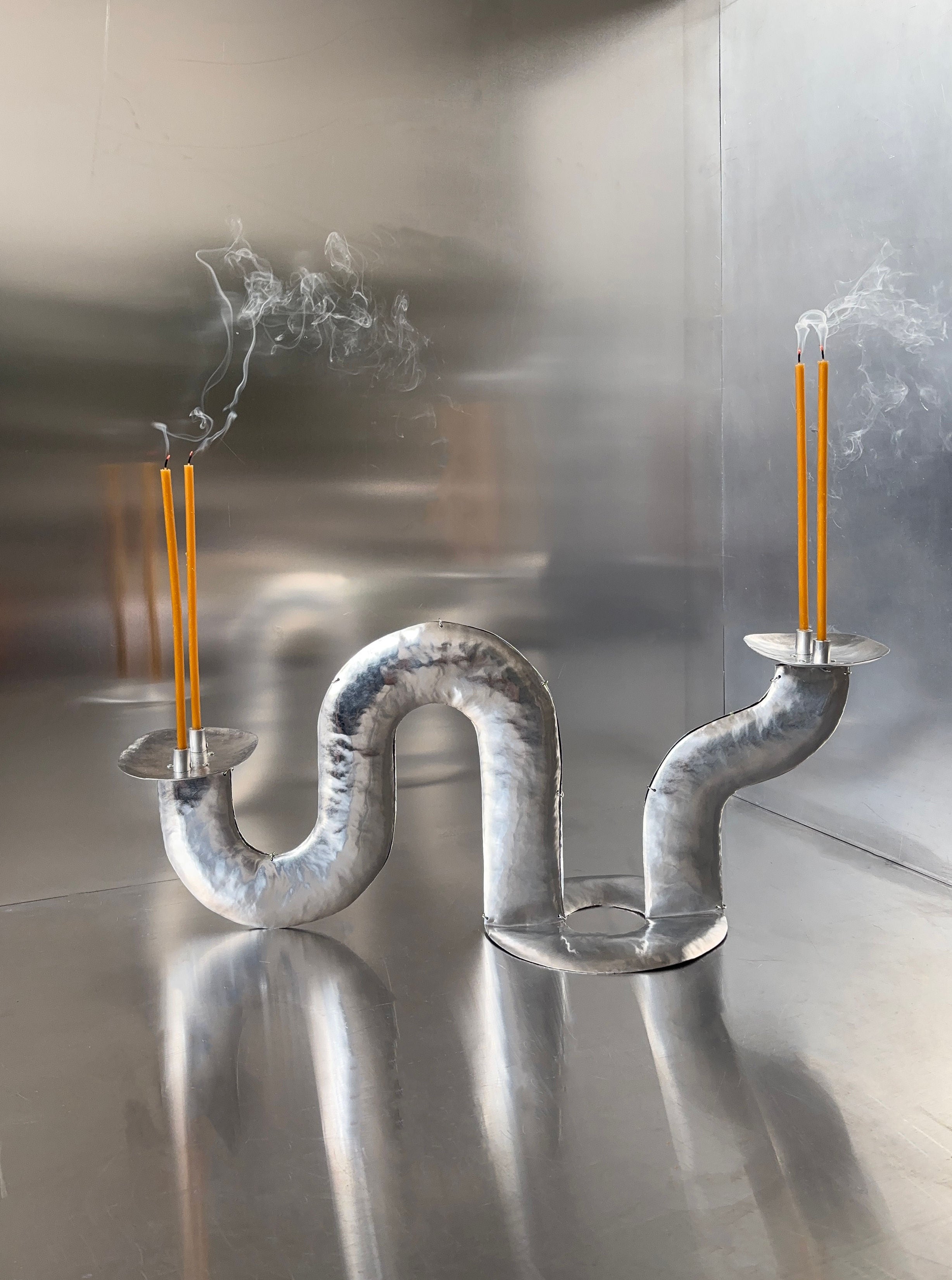 Phaedra Candle Holder Table — close-up of twisted metal design with candles