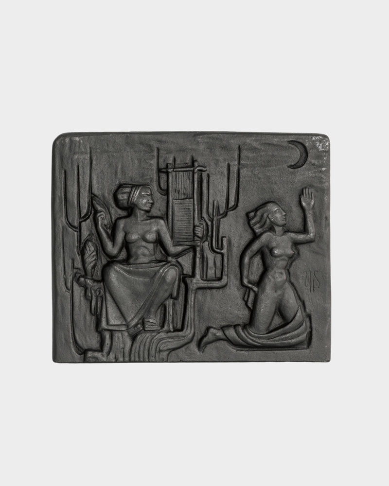 Cast iron wall relief sculpture depicting two figures in desert scene