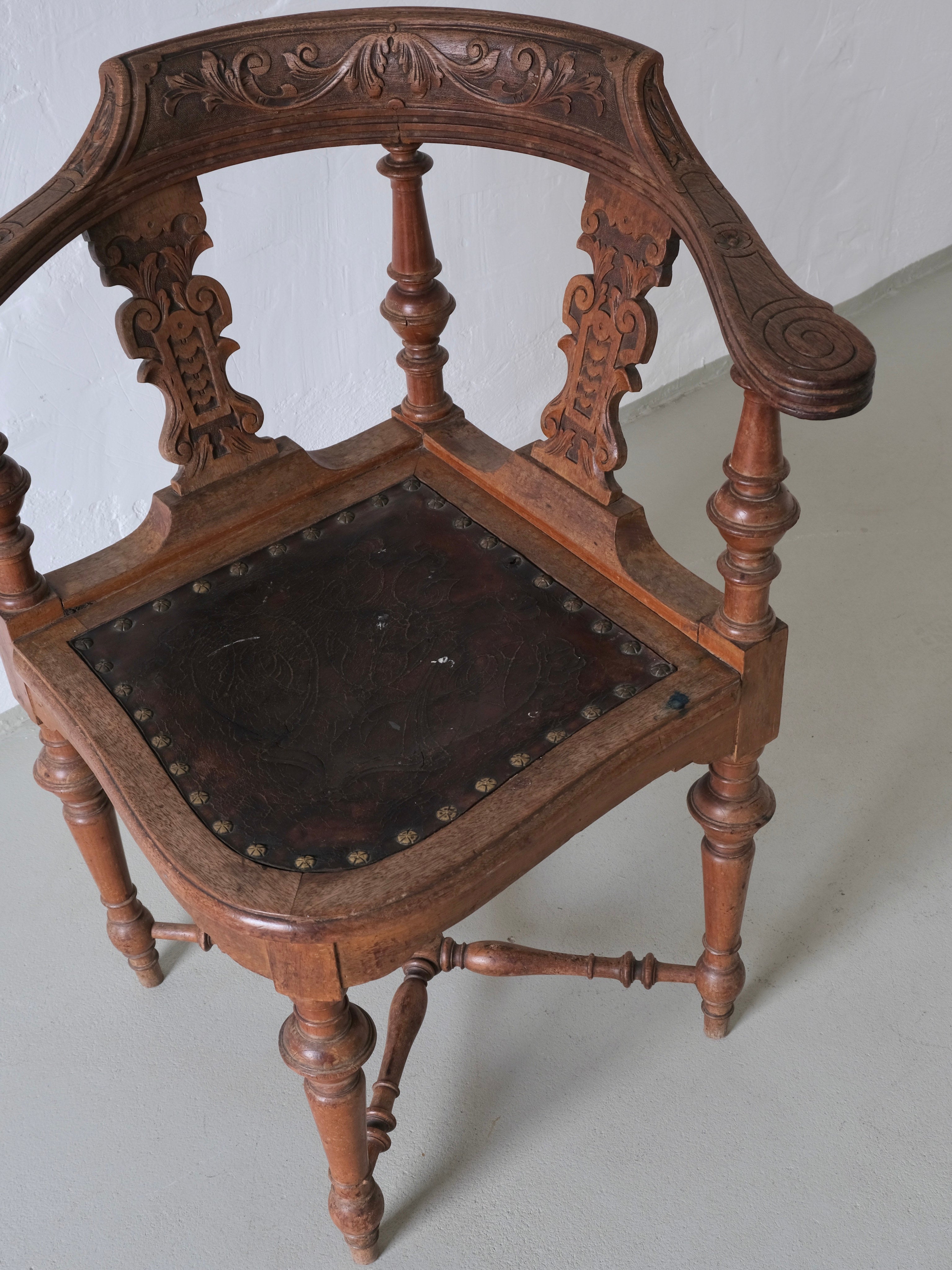 Antique Carved Corner Chair with Leather Seat