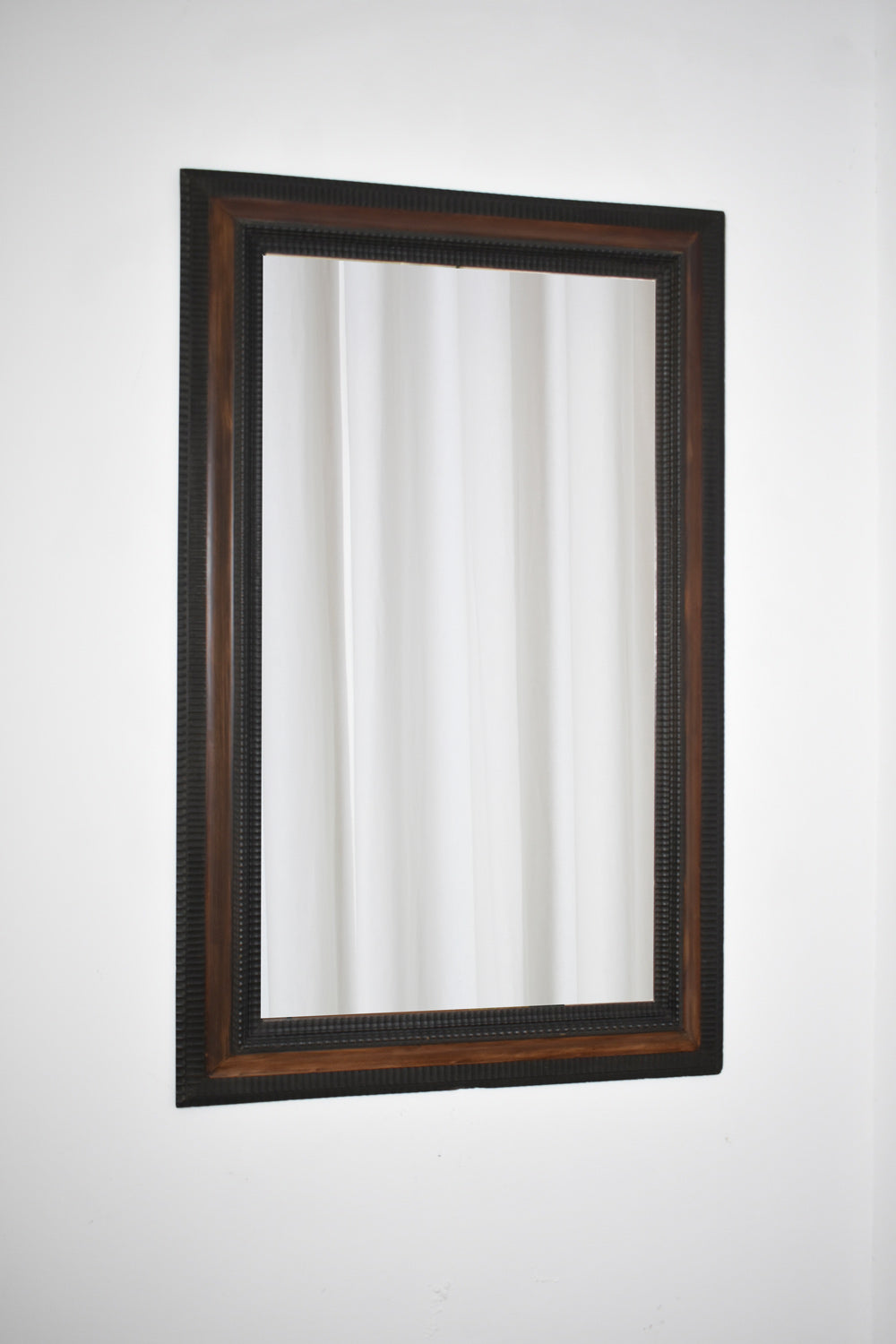 Carved ebonised wood mirror and trompe l'oeil turshell, XIXth c. by Barracuda Interiors | The Oblist