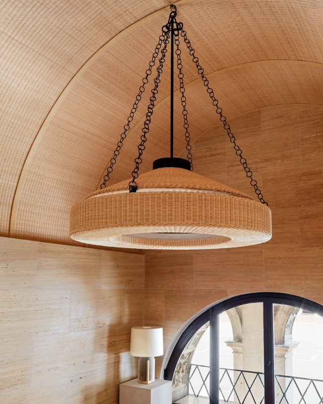 Orion round wicker chandelier with chain suspension in arched ceiling