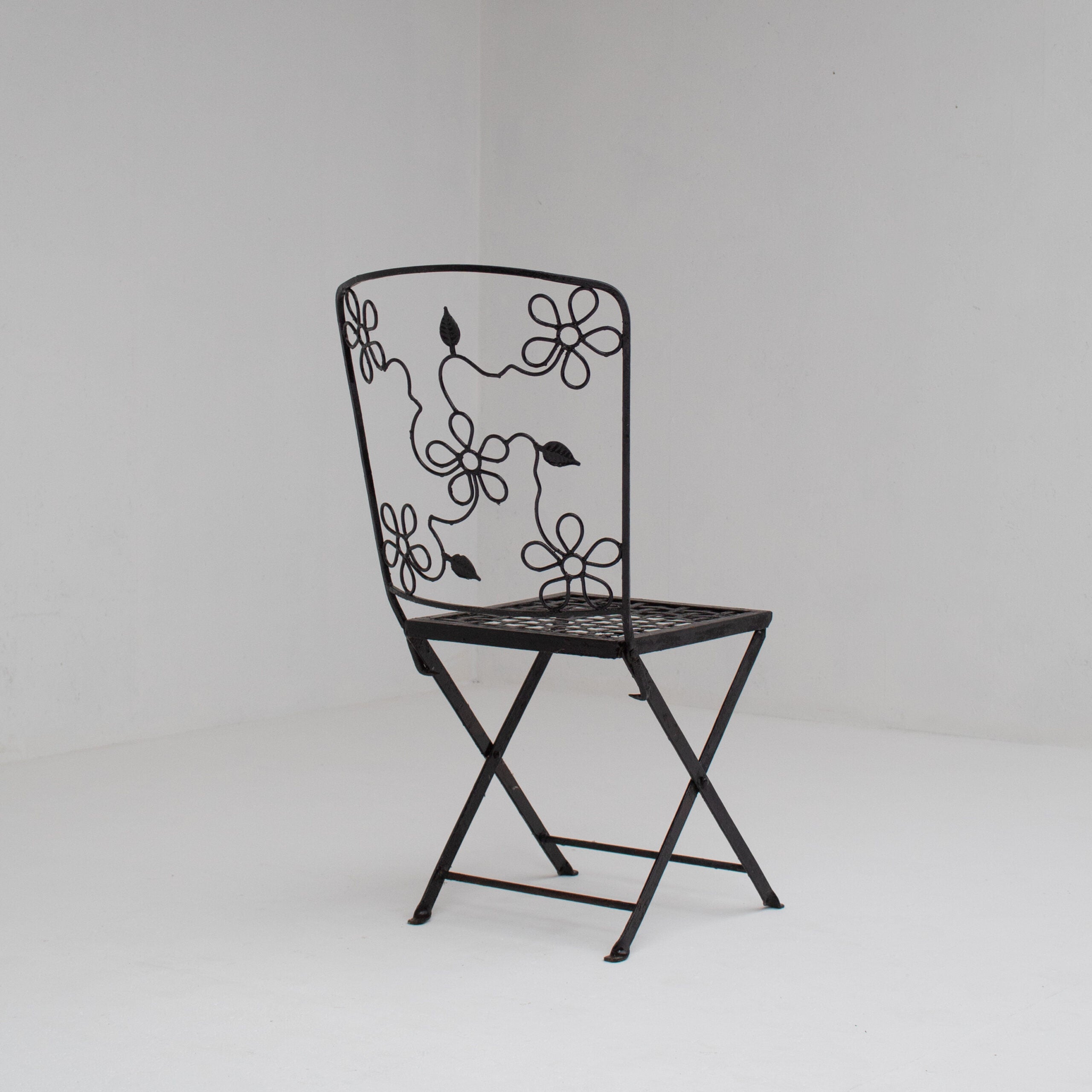Set of Three Decorative Wrought Iron Garden Chairs with Floral Backrests — lifestyle setting