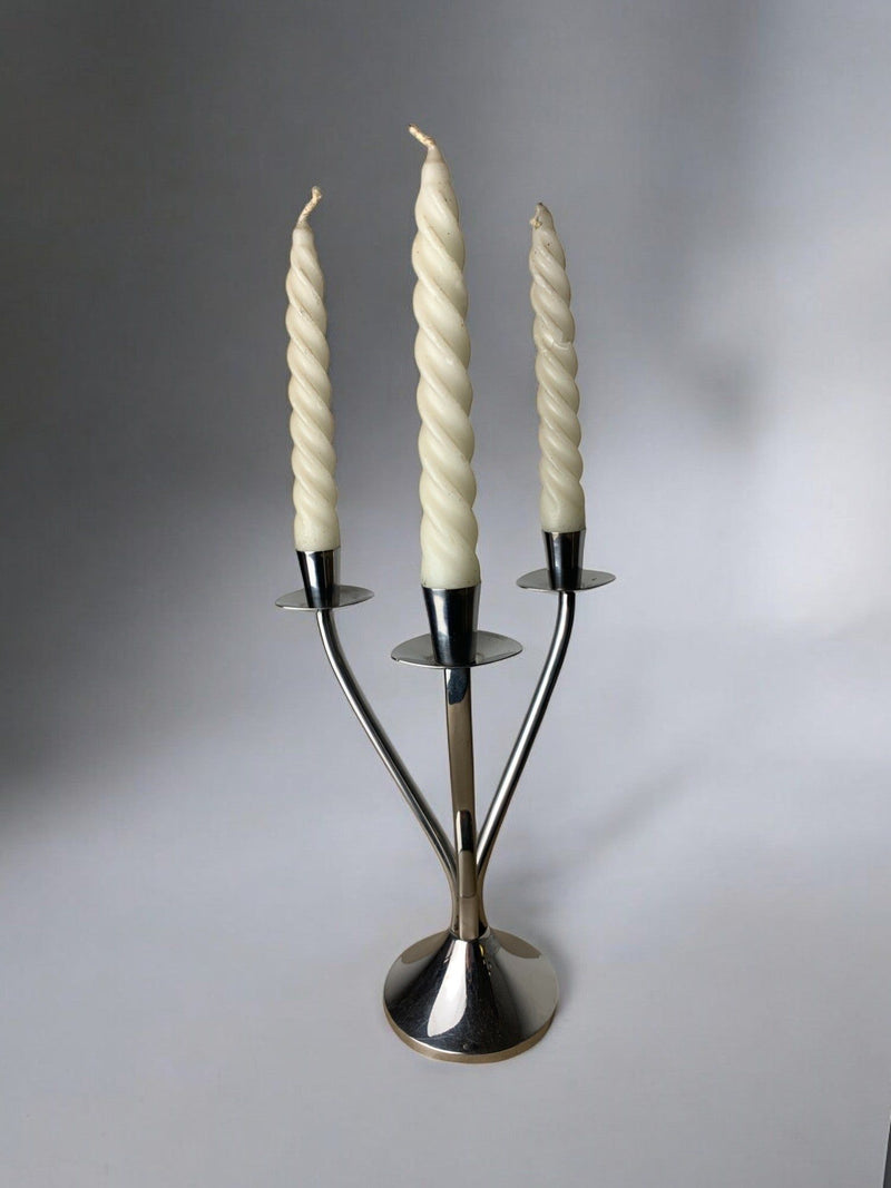 Art deco candlestick in stainless steel 3 flames, Spain, Circa 1970 — close-up of twisted candle detail