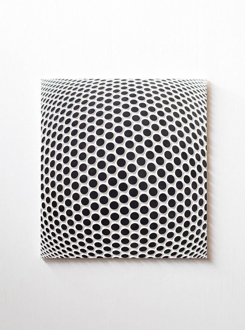 Ommatidium by Studio Arno Hoogland is a square canvas featuring a black and white optical illusion of expanding circles, creating a three-dimensional, dome-like effect on any plain white wall.