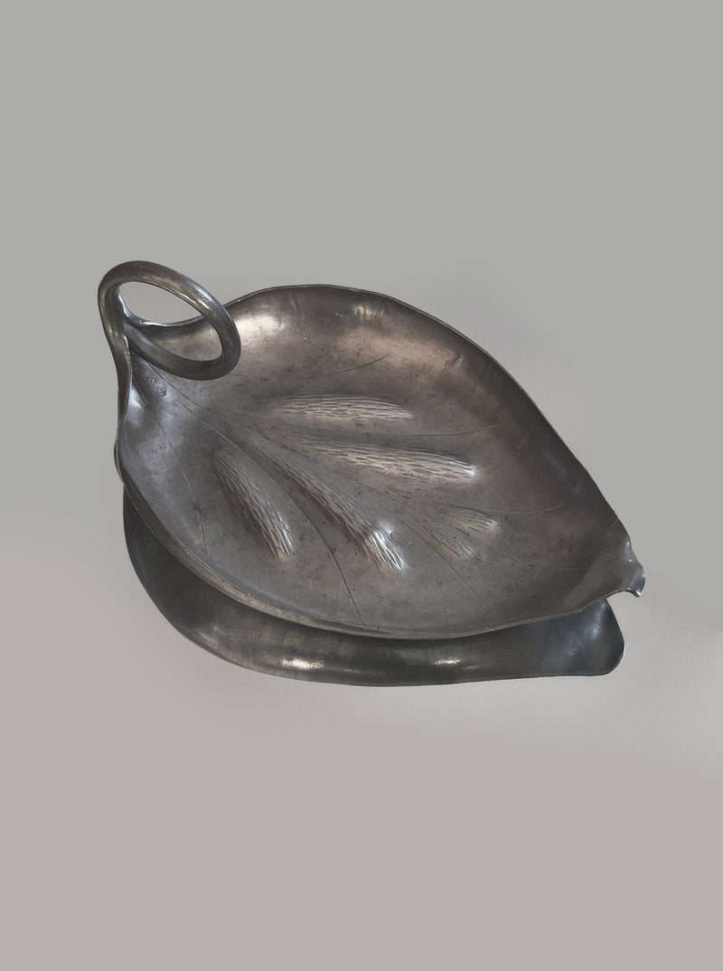 Large pewter leaf-shaped vide poche with elegant curved handle