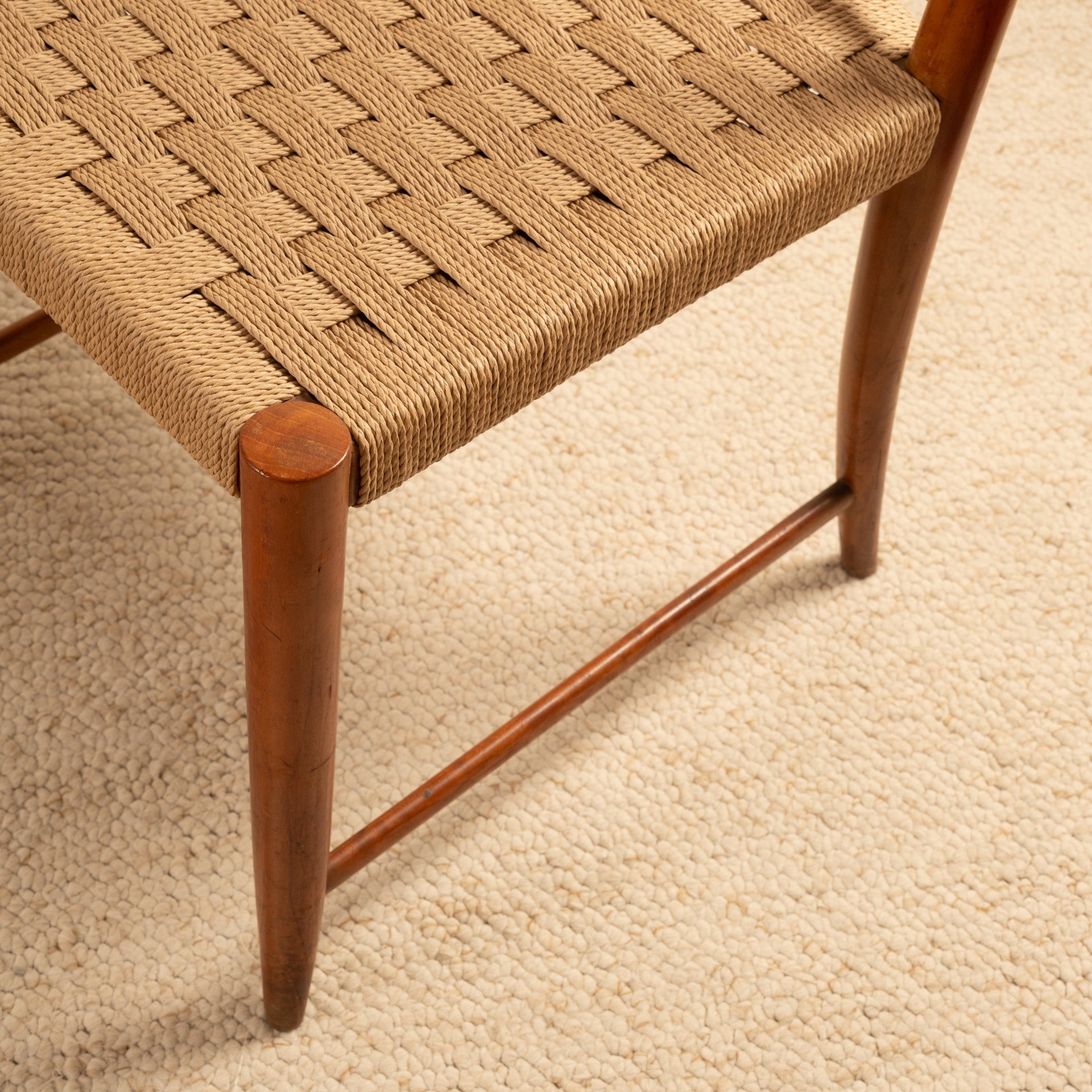Woven rope seat detail of Paolo Buffa chair with tapered legs