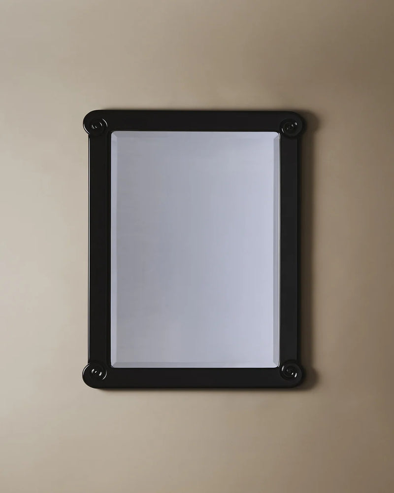 Black framed rectangular mirror with rounded corners by Astrid Houssin