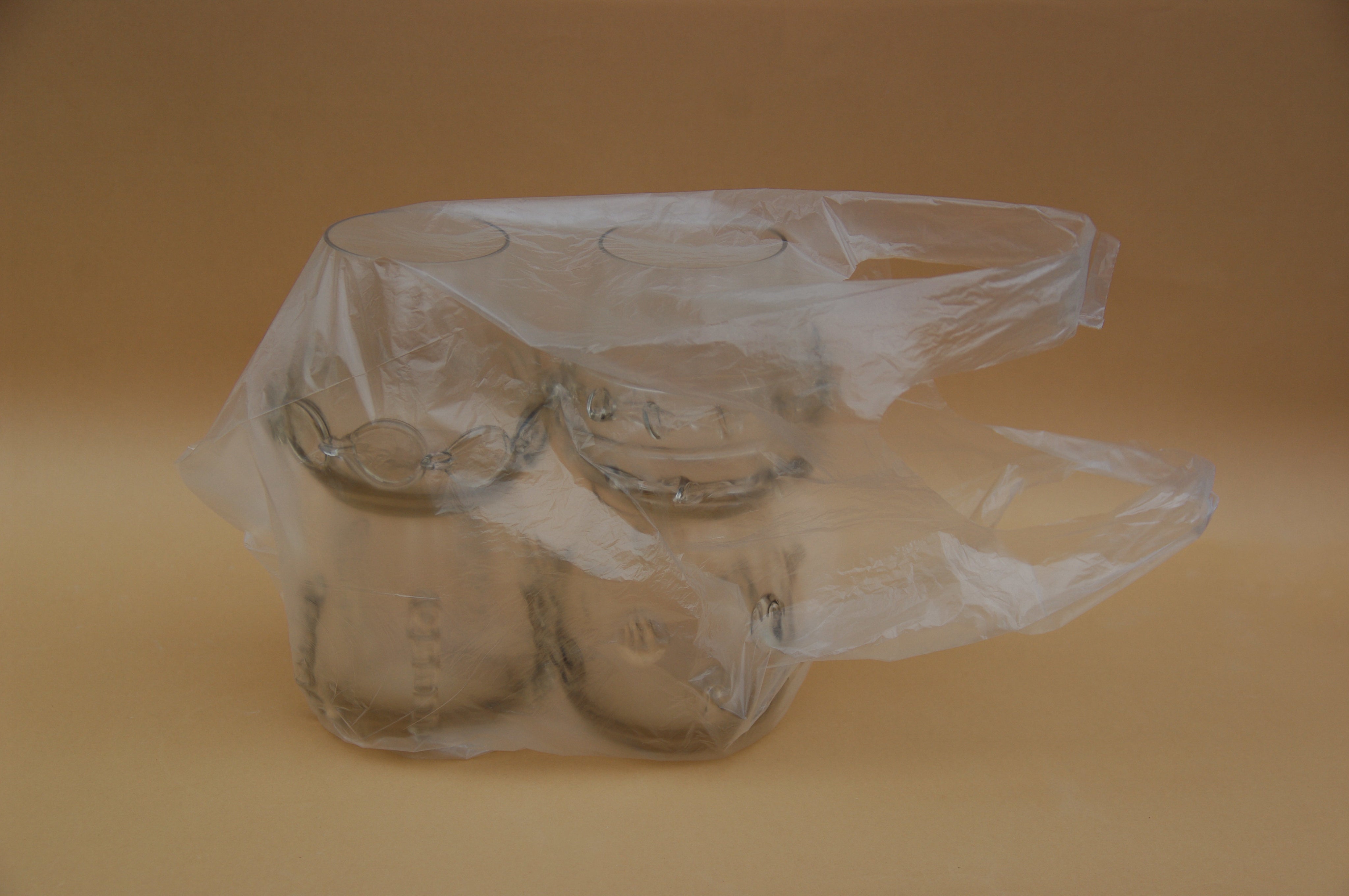 Contemporary Tumblr - Set of four handblown glass vessels — side view in plastic packaging
