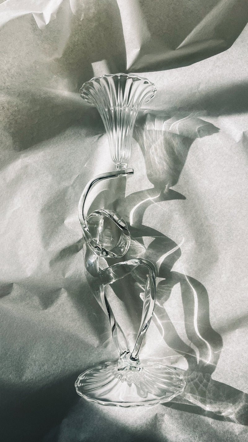 Crystal glass ribbon-shaped candleholder with fluted top and curved stem