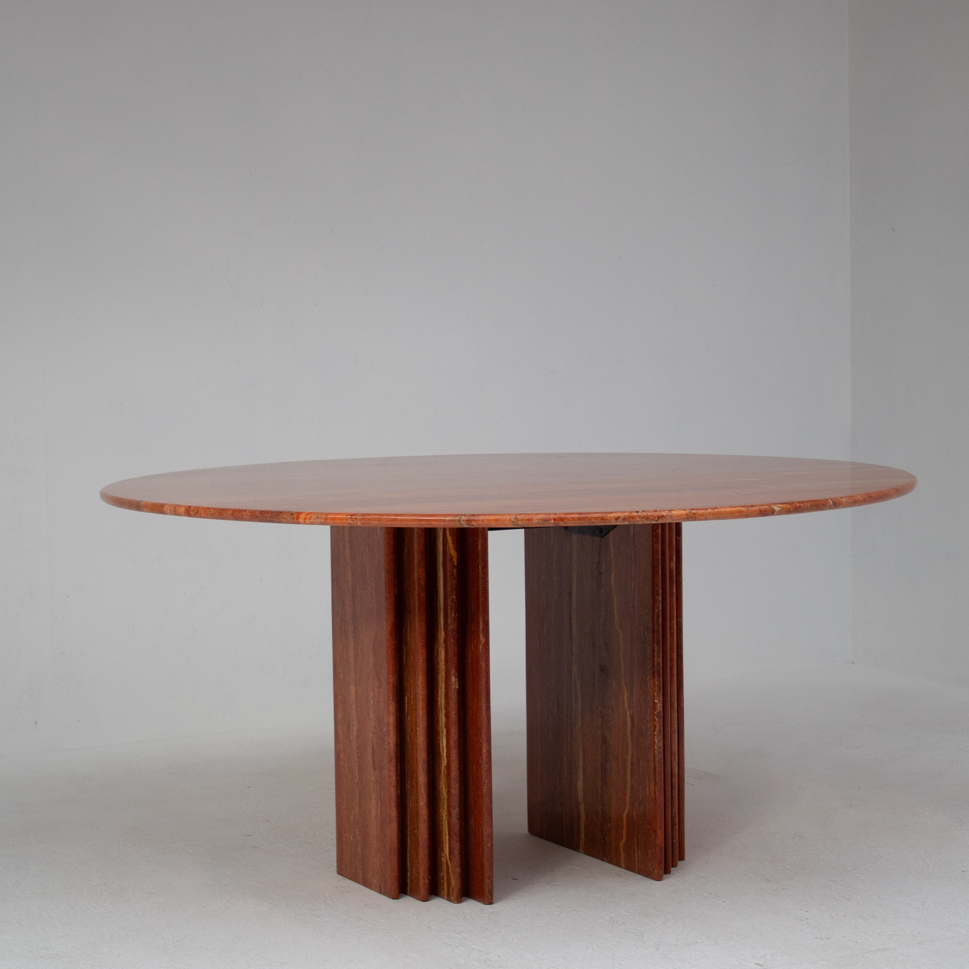 Round Dining Table in Rosso Travertino