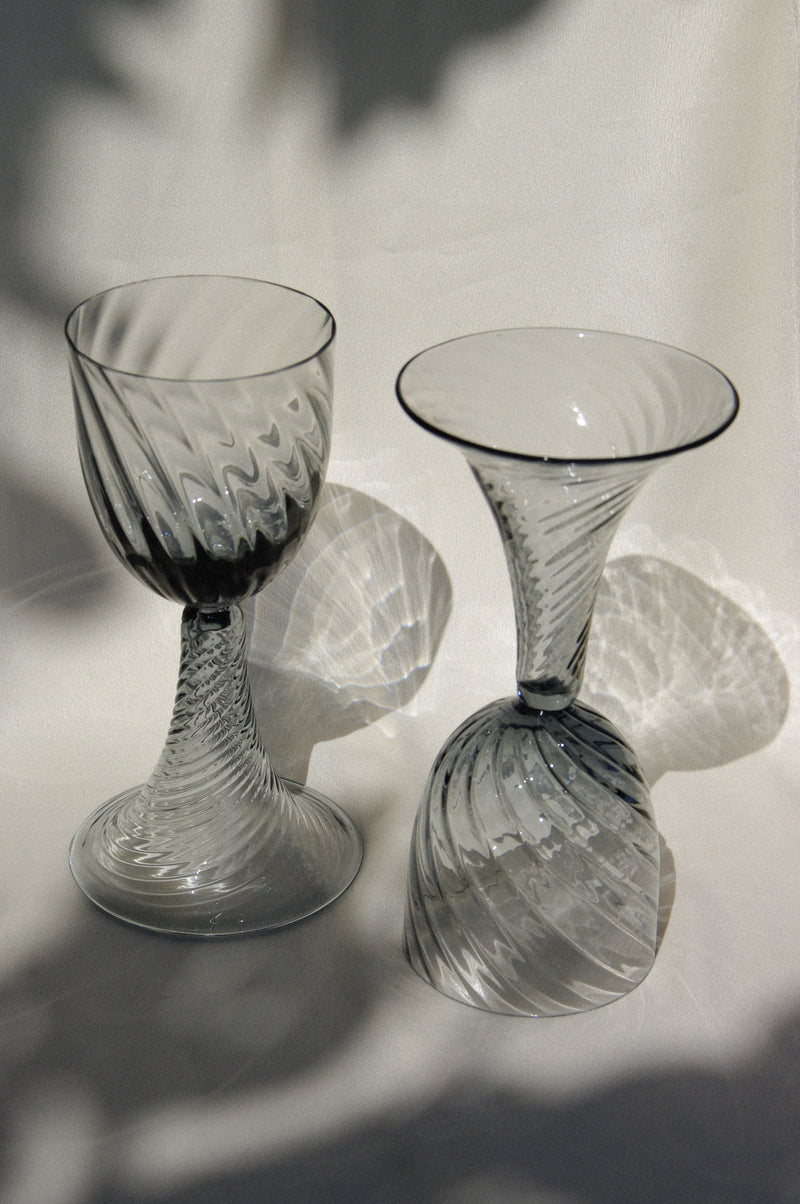 Pair of Mouthblown Wine Goblets in glass — close-up of swirling glass patterns