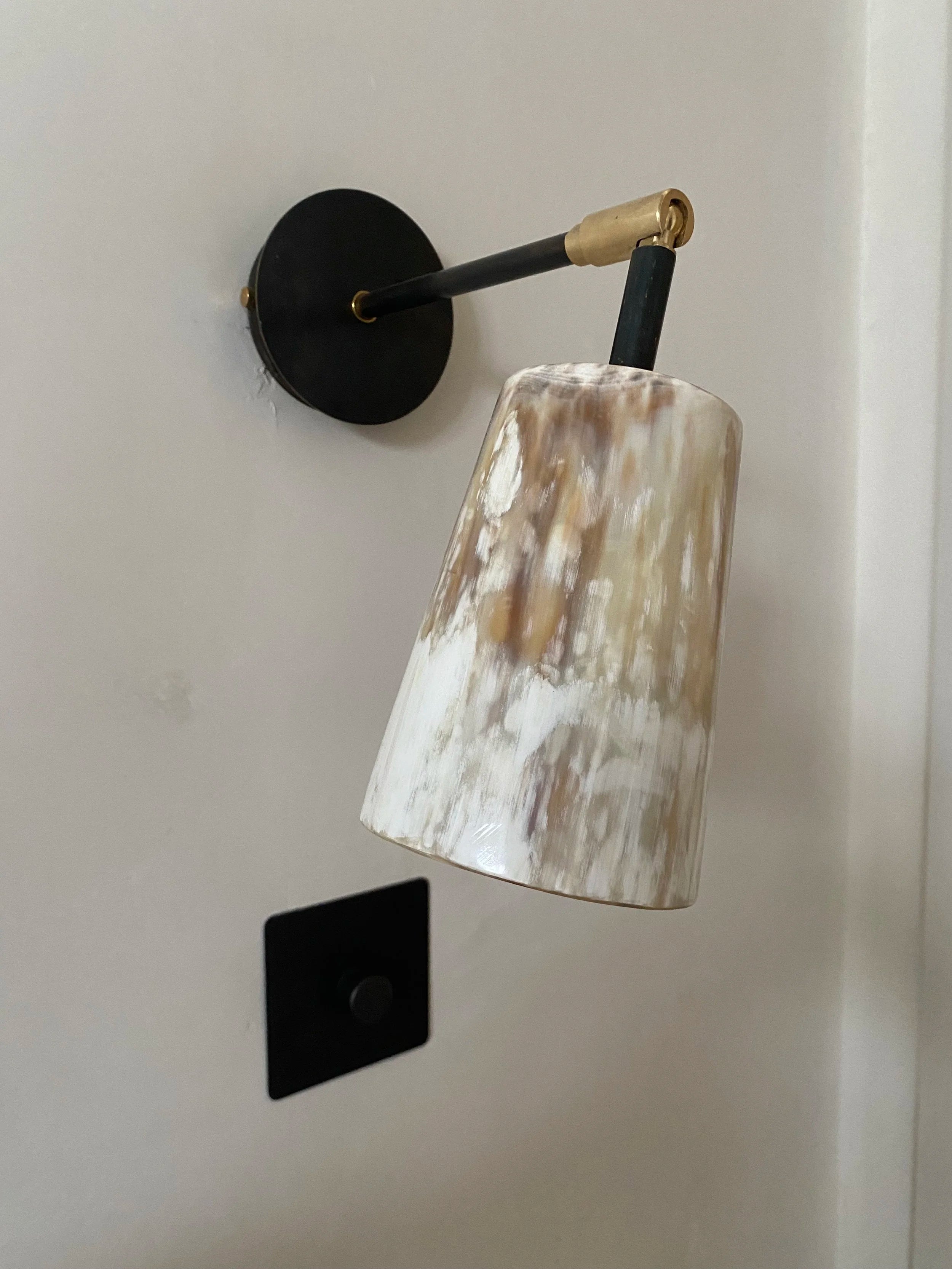 Horn Wall Light — angled view showing ceramic shade and black mount