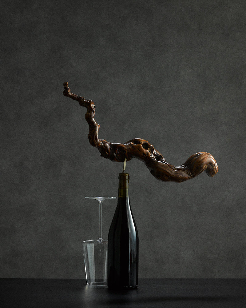 oversized vine root corkscrew — close-up of handcrafted wood detail