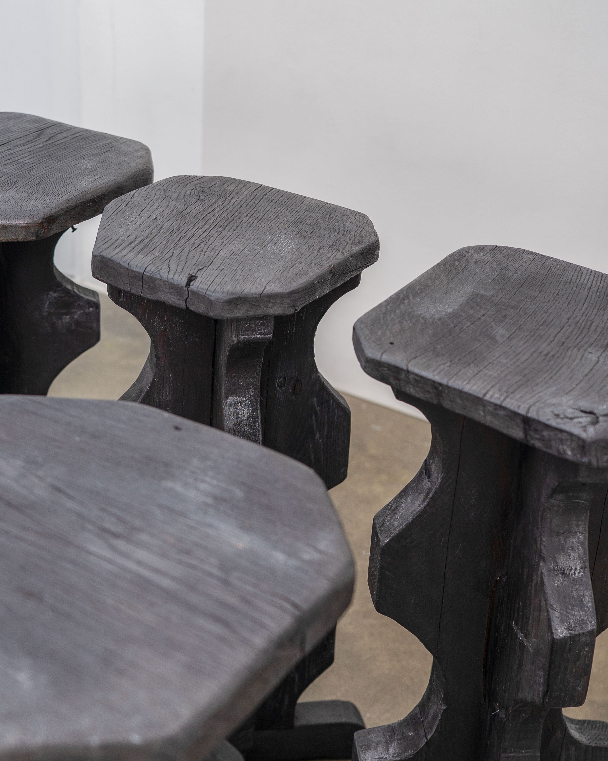Sculptural Brutalist Bar Stools — close-up of dark wood texture