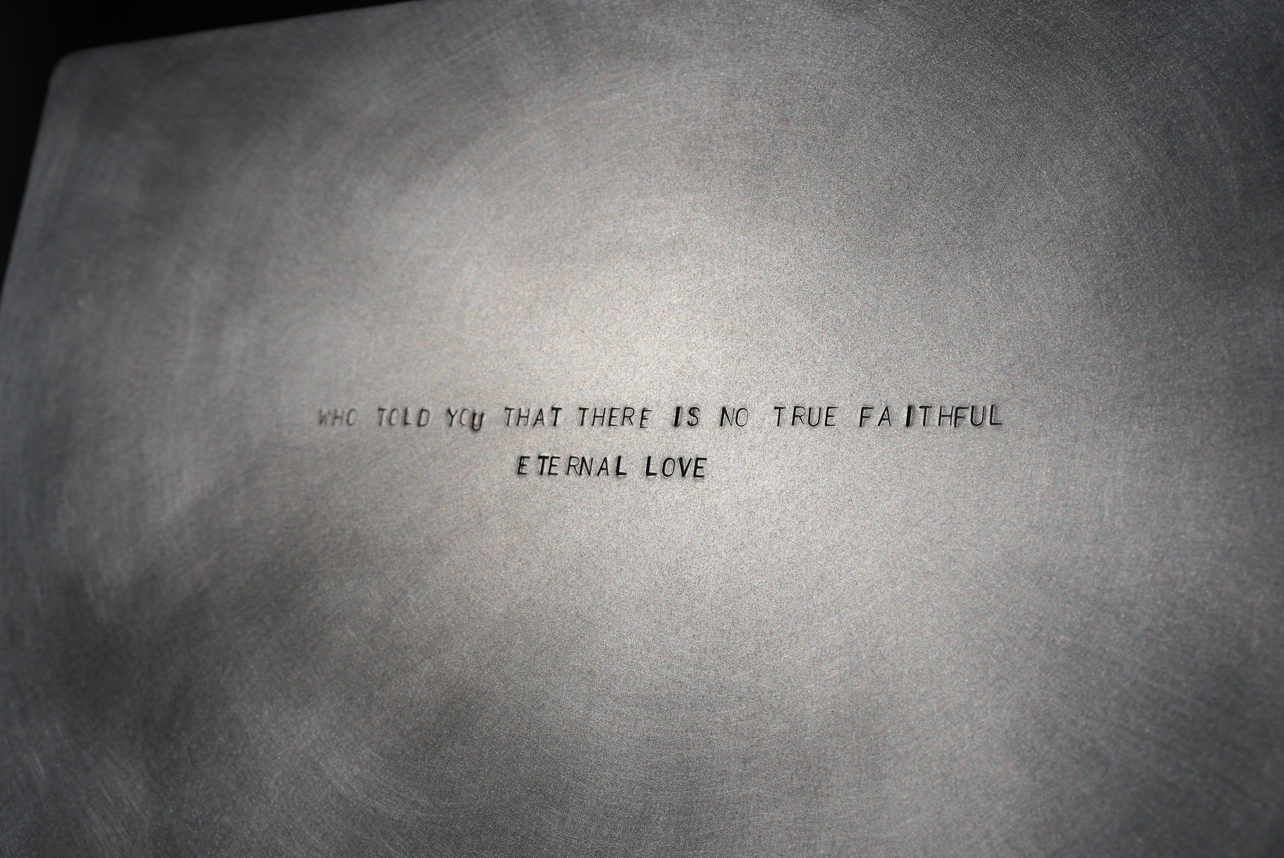 MASTER & MARGARITA — close-up of engraved metal surface