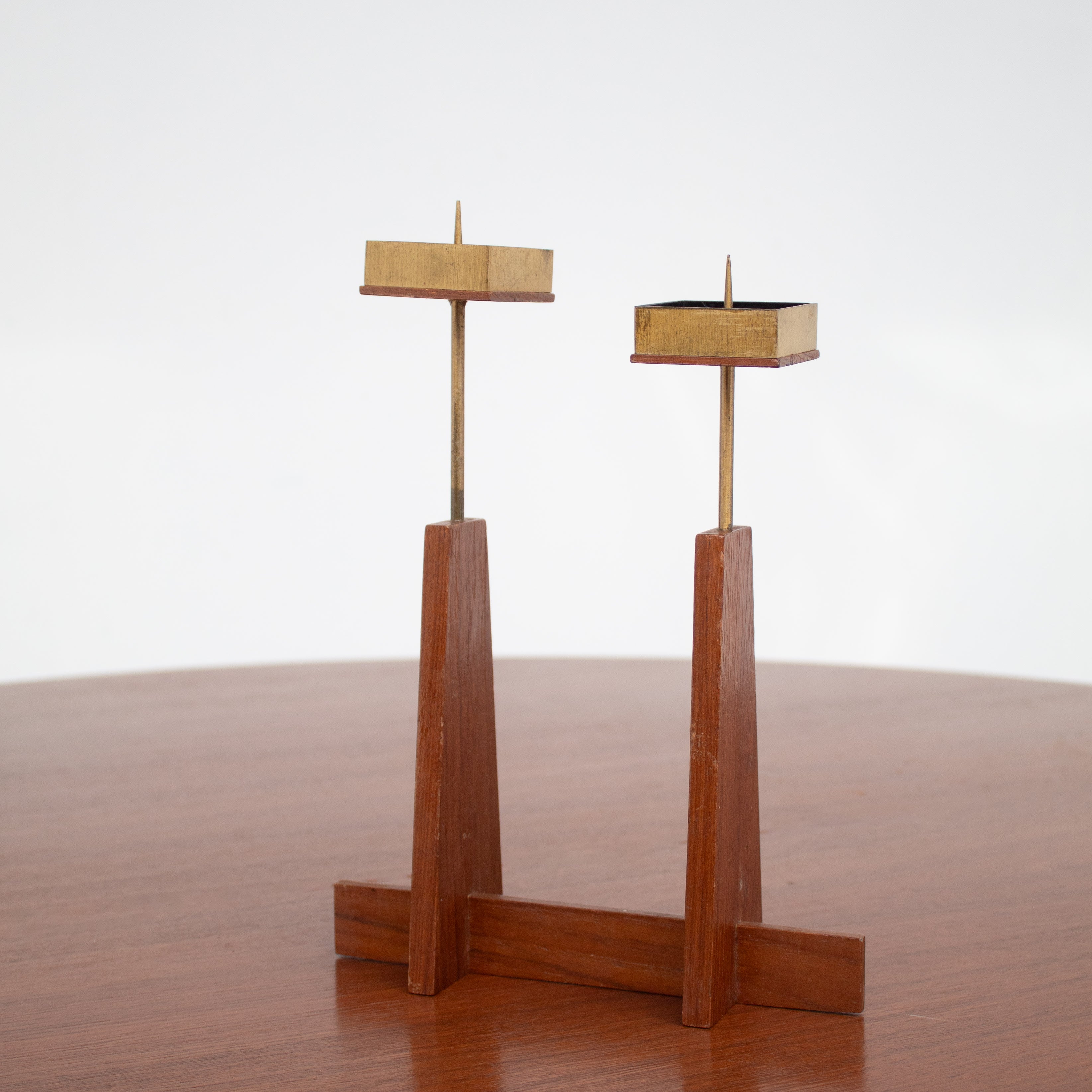Vintage Candle Holders in Wood / Teak — close-up of wooden base and brass tops