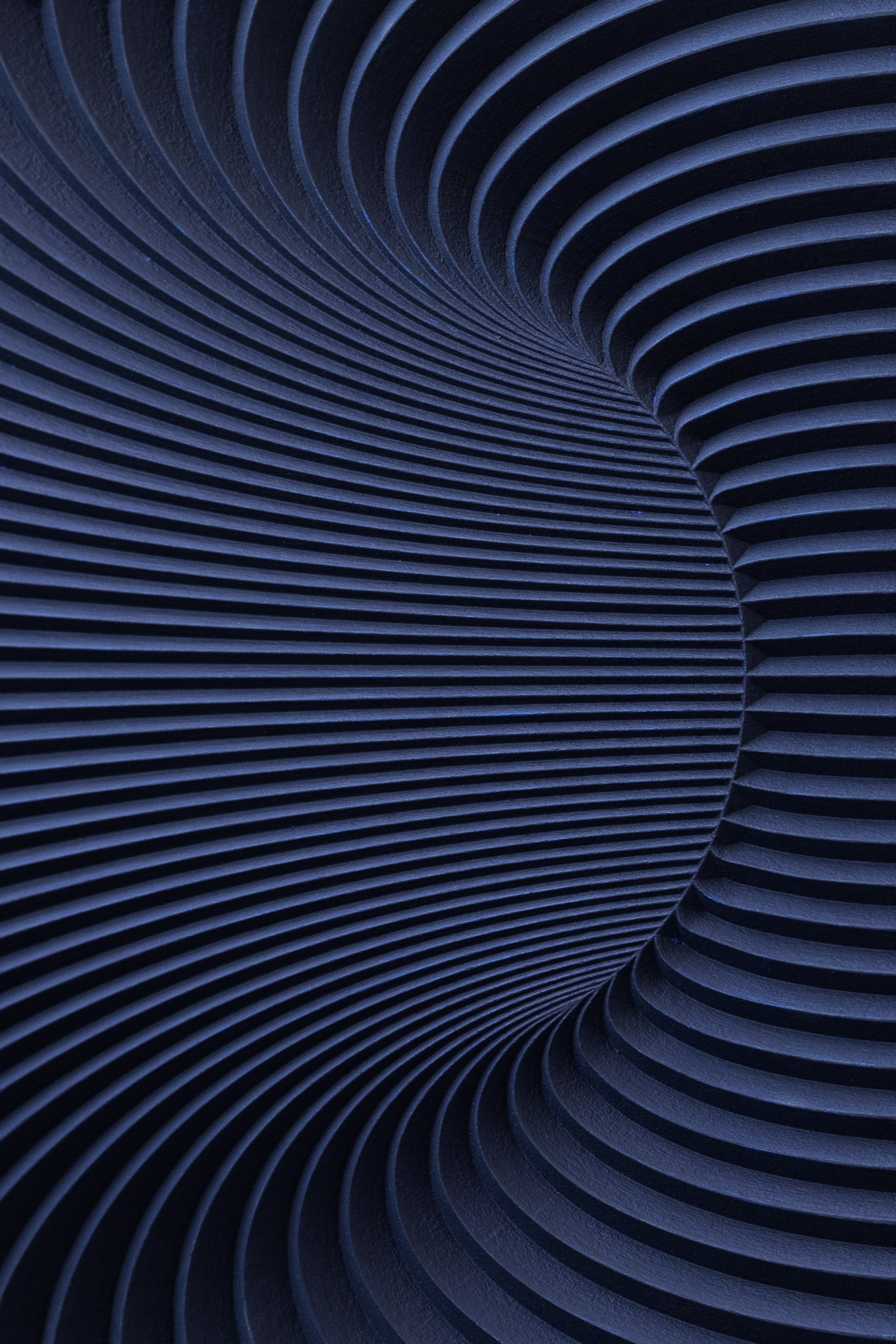 Wormhole Sculpture — side angle showing deep blue ridged surface