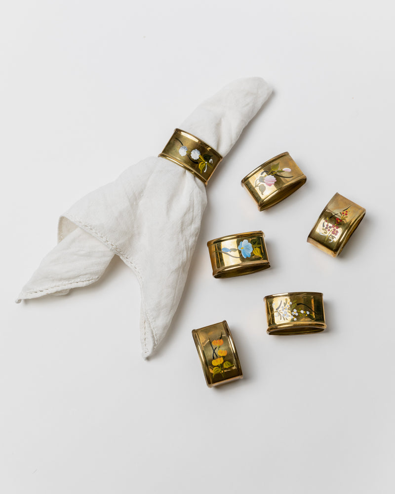 Set of six brass napkin rings with floral motifs, Italy 1940s