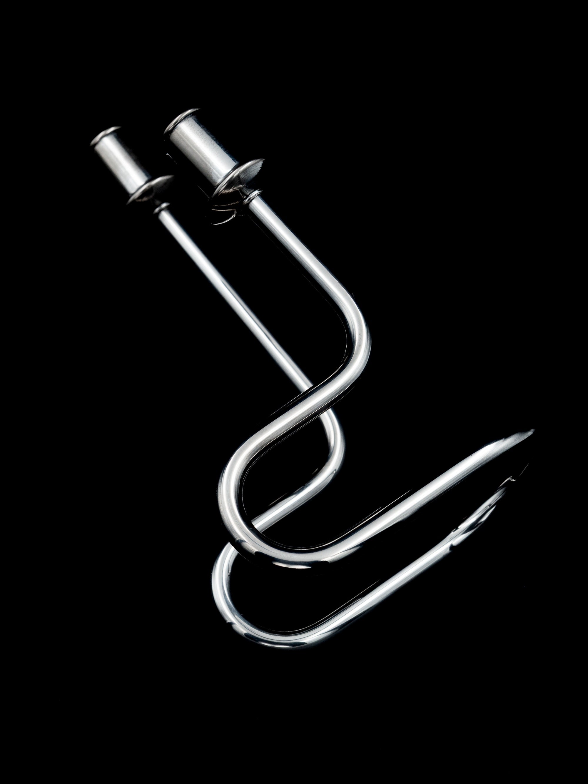 Continuous Loop Candle Holder, Italy, c. 1950s — side angle highlighting polished metal finish