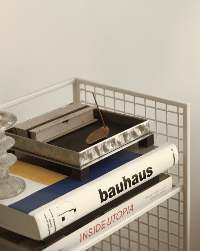 Yuma leather tray styled with books and decorative objects