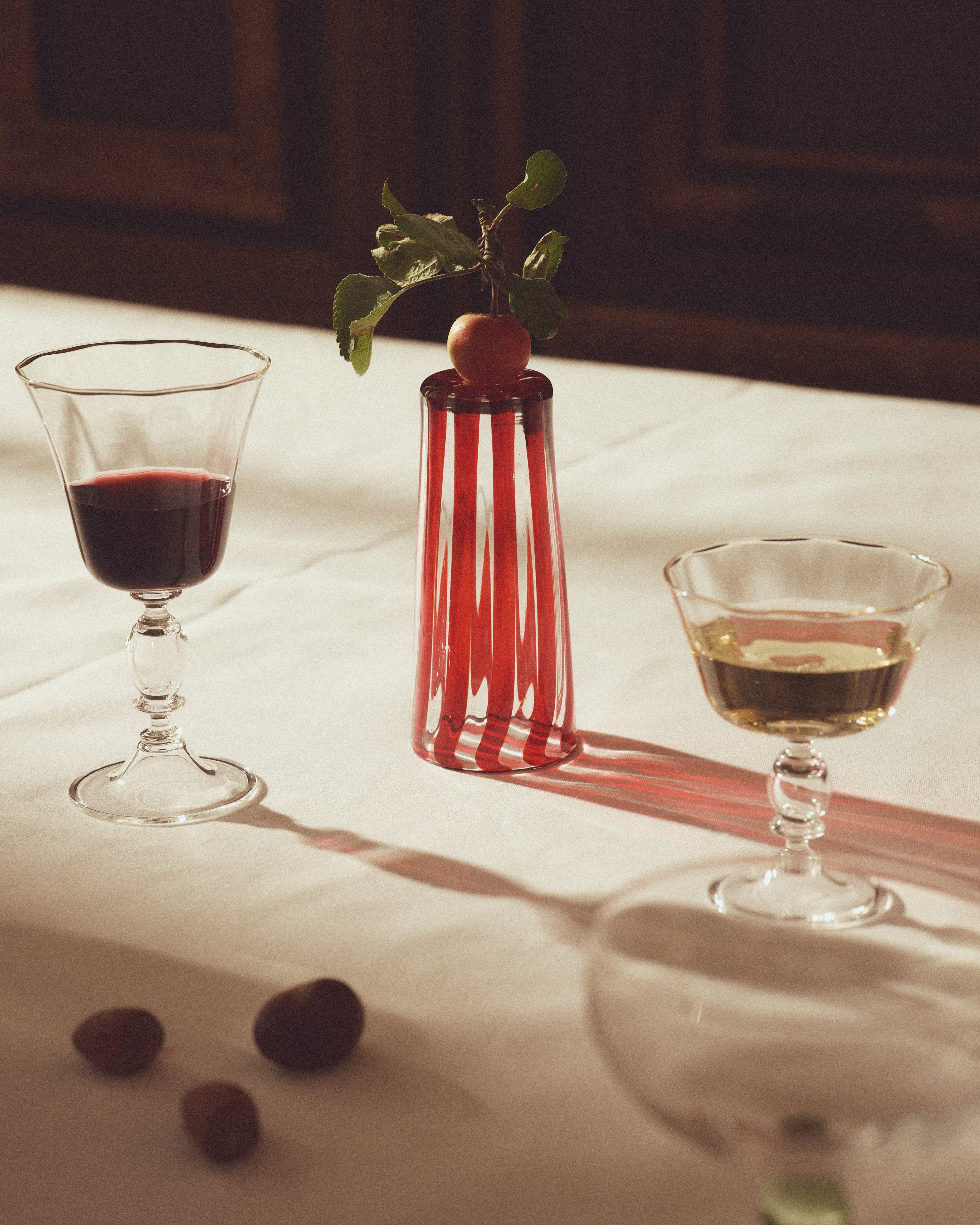 Alban Wine Glass Large - Set of Four — top view with red and clear glass on table