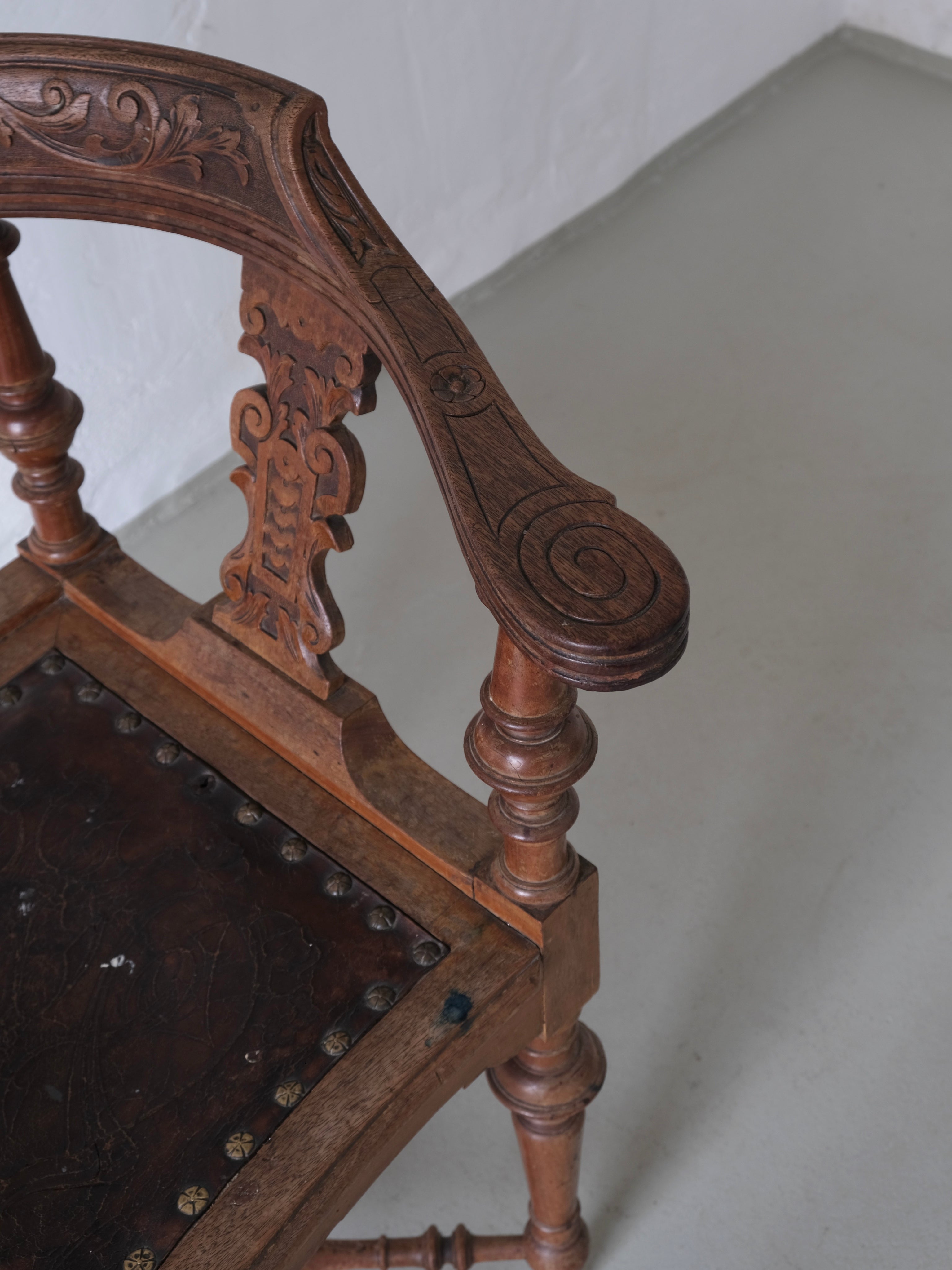 Antique Carved Corner Chair with Leather Seat
