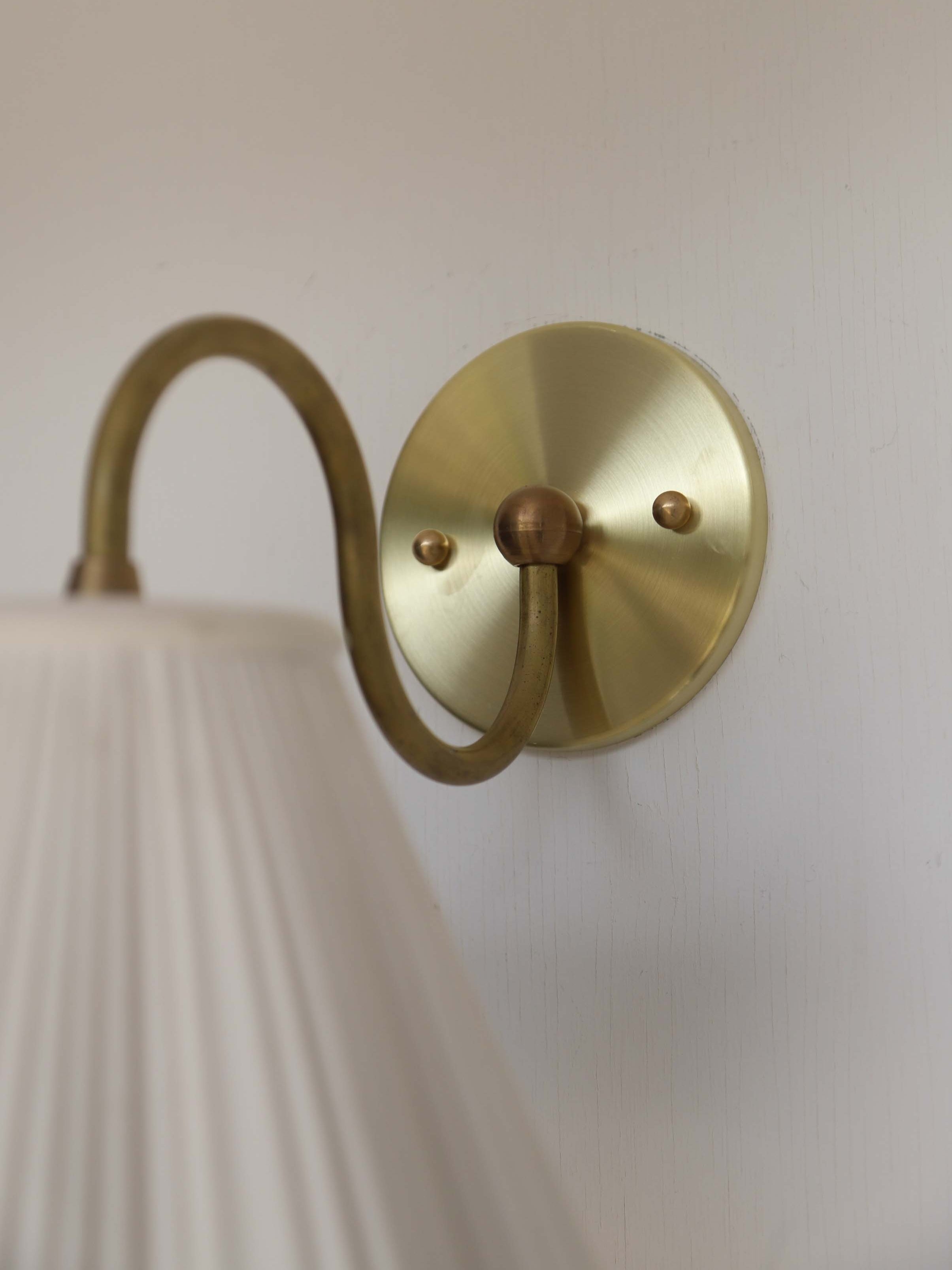 Lucy Sconce — side angle showing brass wall mount and white shade