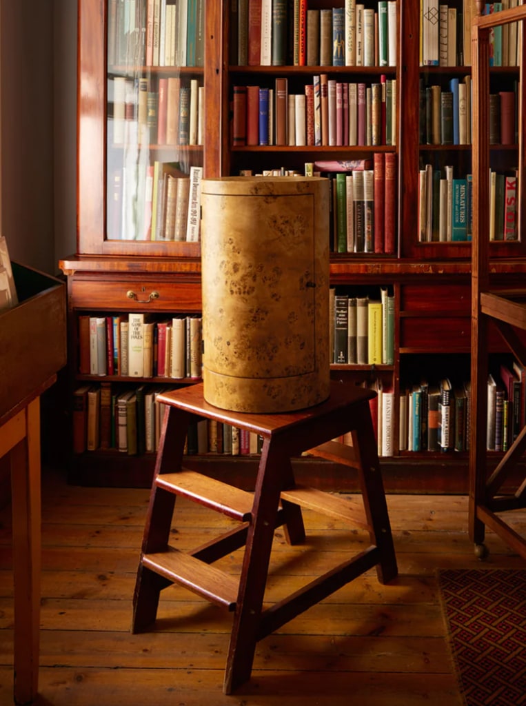 Pair of Constant Nightstand in Poplar Burl — side angle showing burl texture in library setting