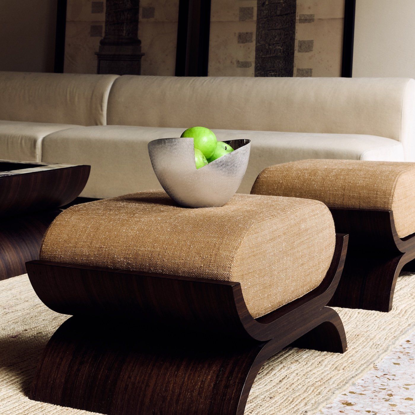 Silver-plated bowl | Vela — positioned on textured ottoman with apples