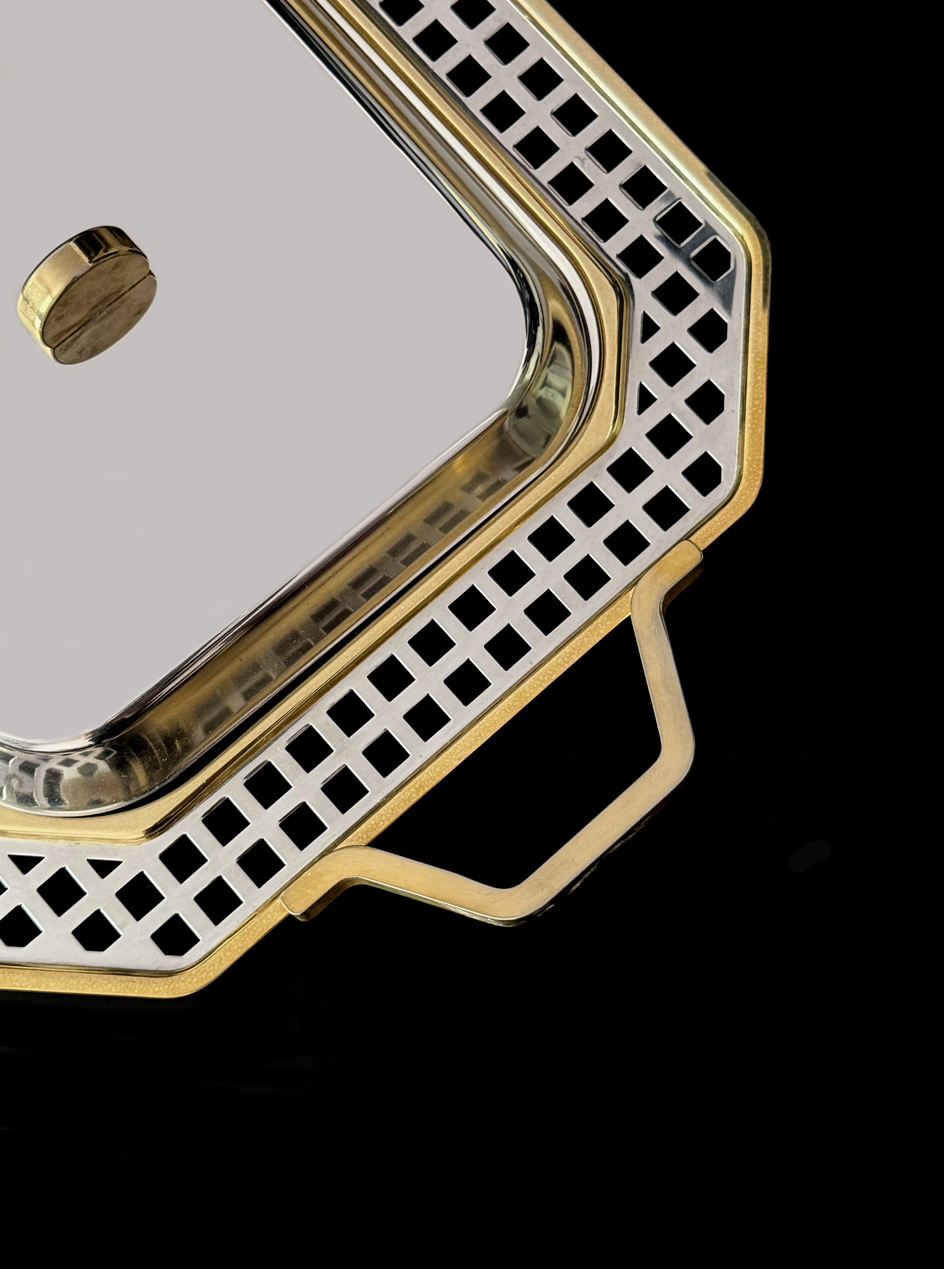 Vintage tray from 1970s Italy is a polished stainless steel — detail view