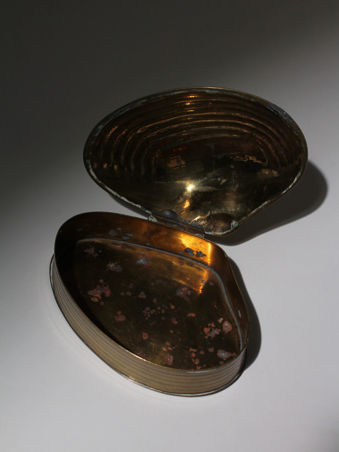 Brass Clamshell Trinket Box — close-up of open brass interior