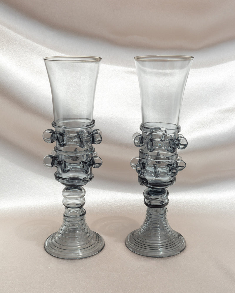 Pair of mouthblown glass champagne flutes with seaweed-inspired stems