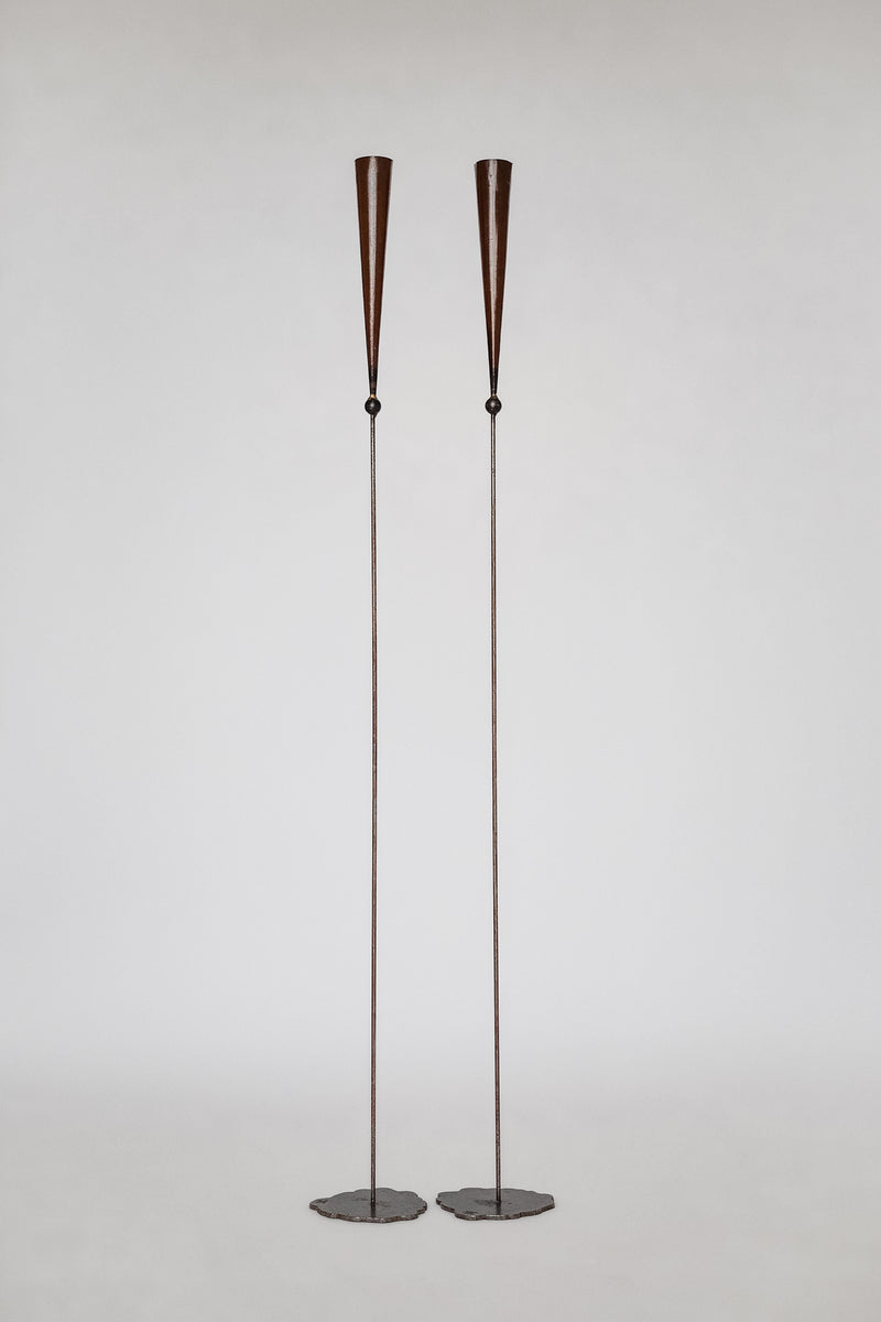 Pair of tall copper candle sconces with conical shades by Pieter Spruyt