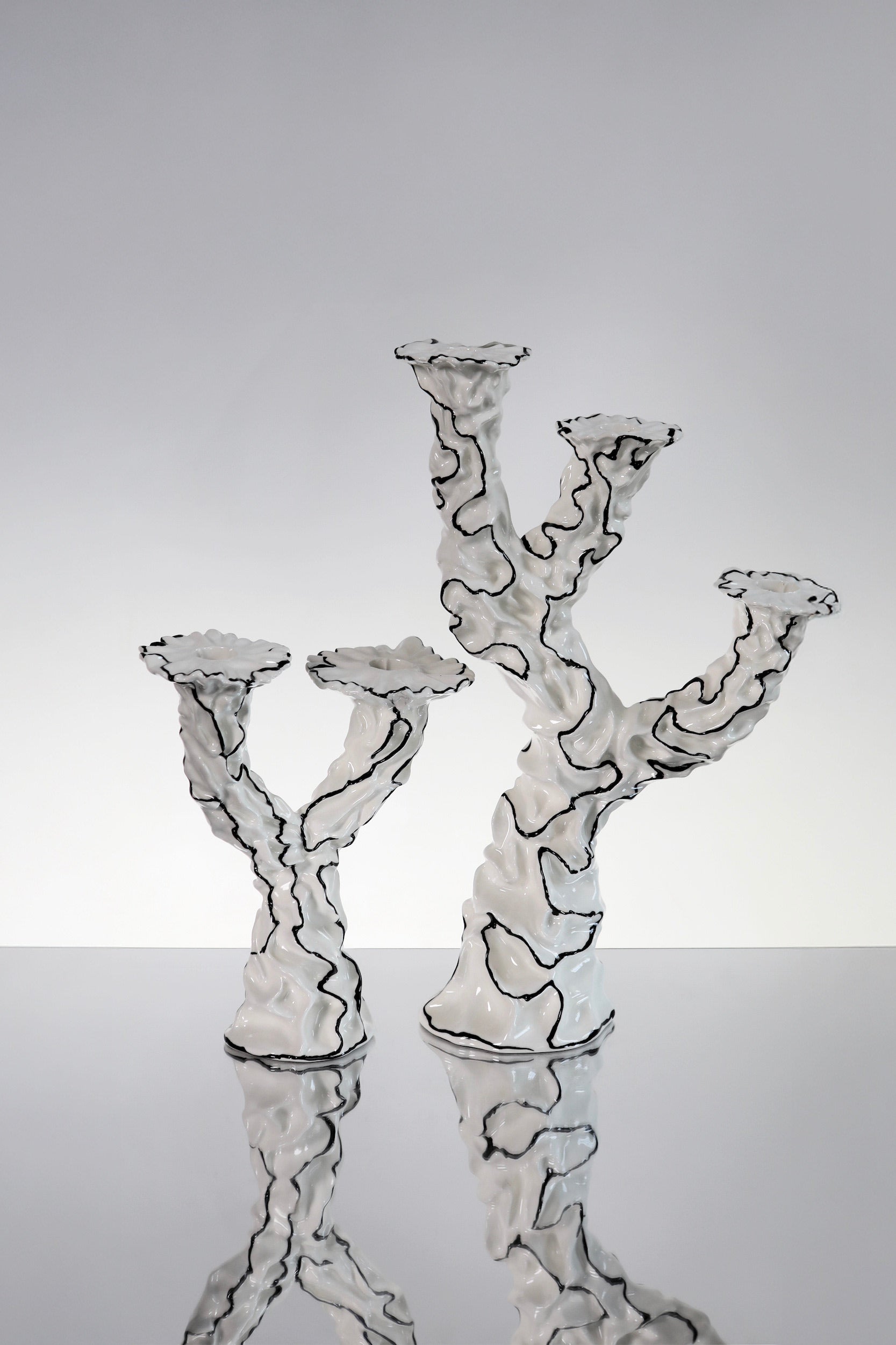 Three Wishes Candle Holder — side angle of white ceramic design