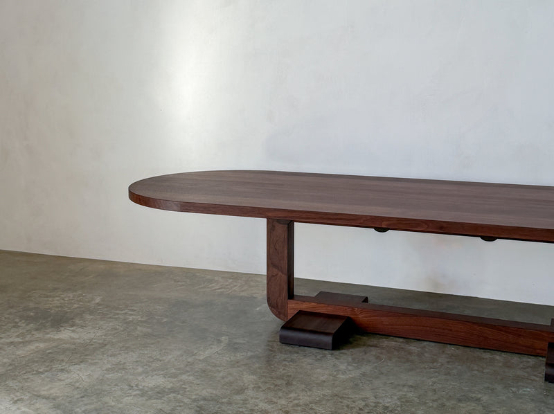 Alpen Long Dining Table — close-up of walnut wood surface and base