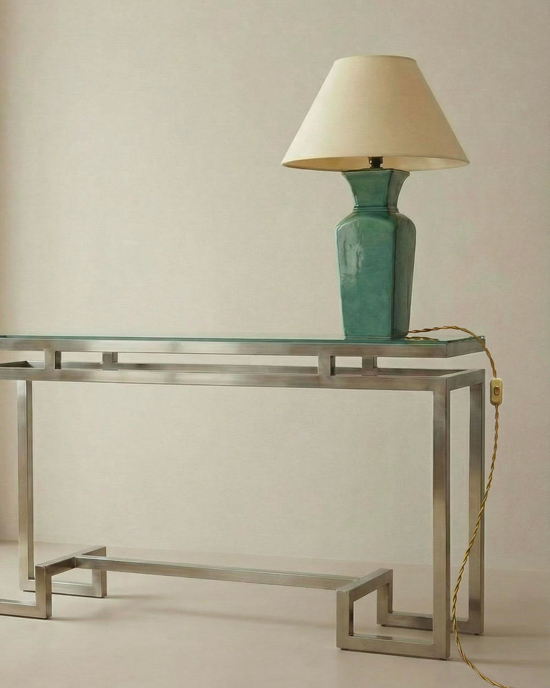 Pair of Art Deco Ceramic lamp By Paul Millet Manufacture de Sevres — close-up of green ceramic lamp on metal console