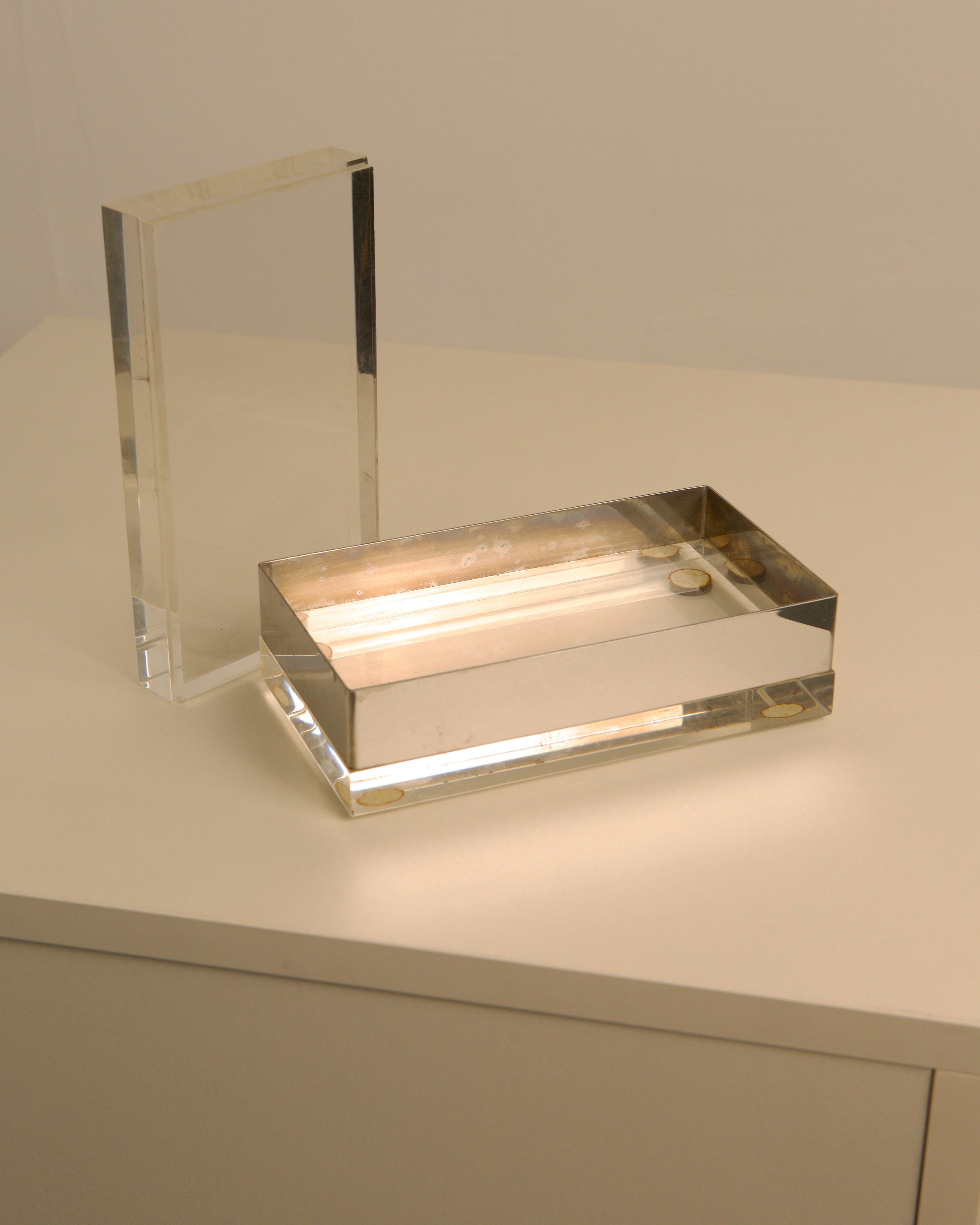 Clear acrylic Italian decorative box with warm interior lighting detail
