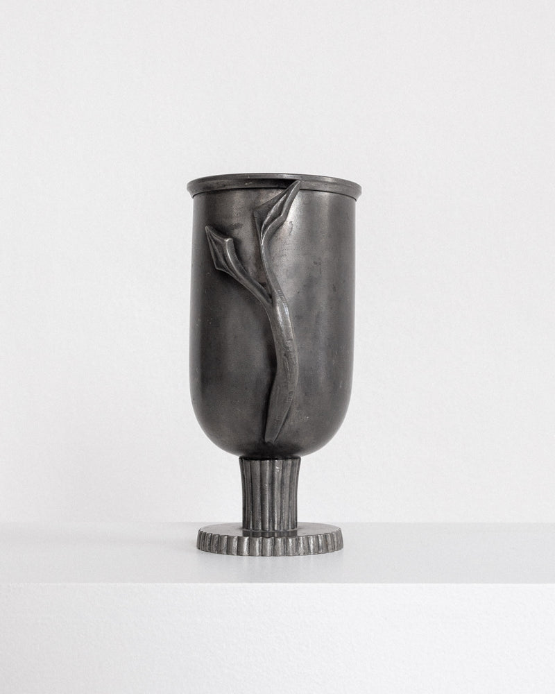 Swedish pewter vase profile showing raised tulip relief design
