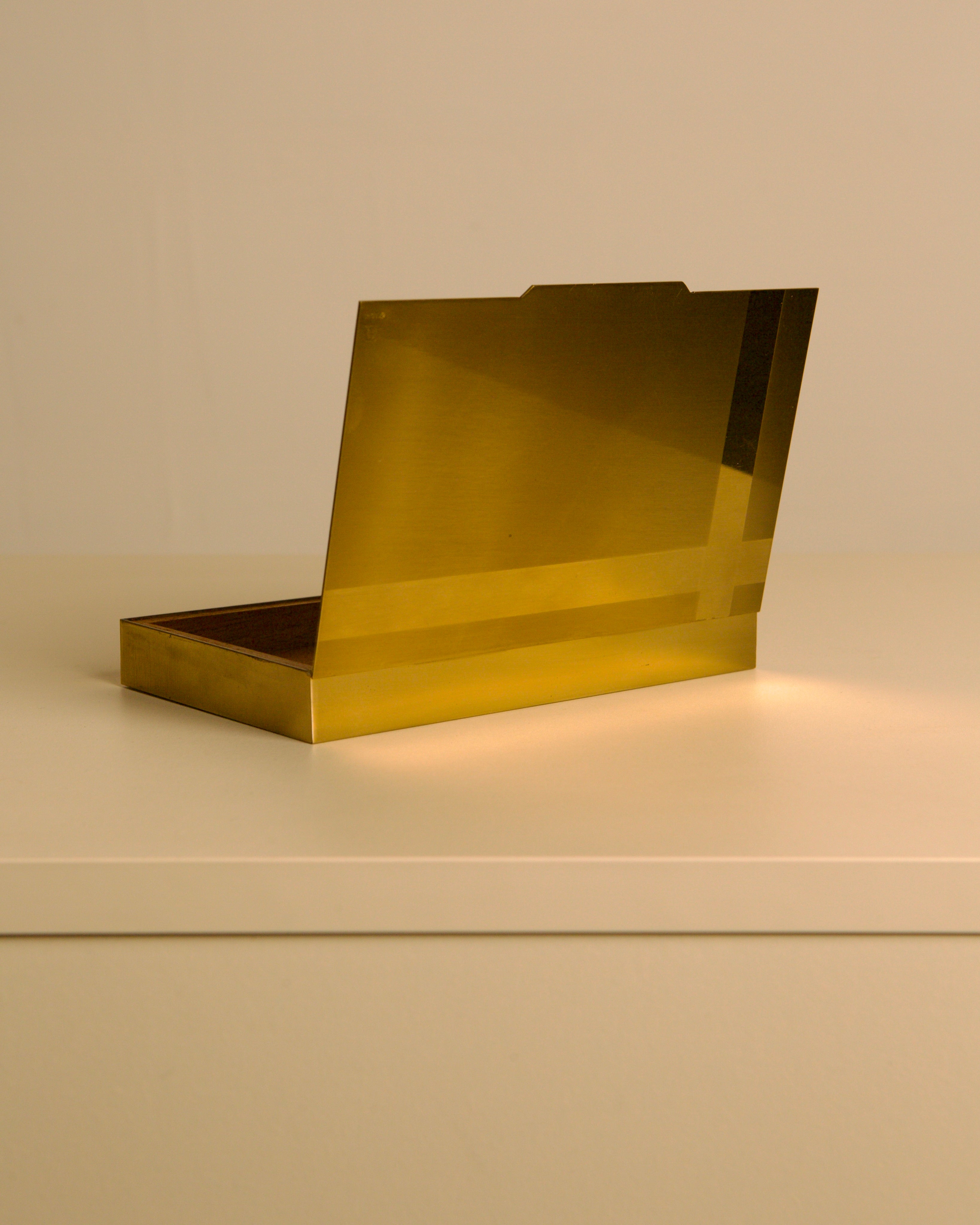 Italian 60s brass and wood rectangular box — top view on light surface