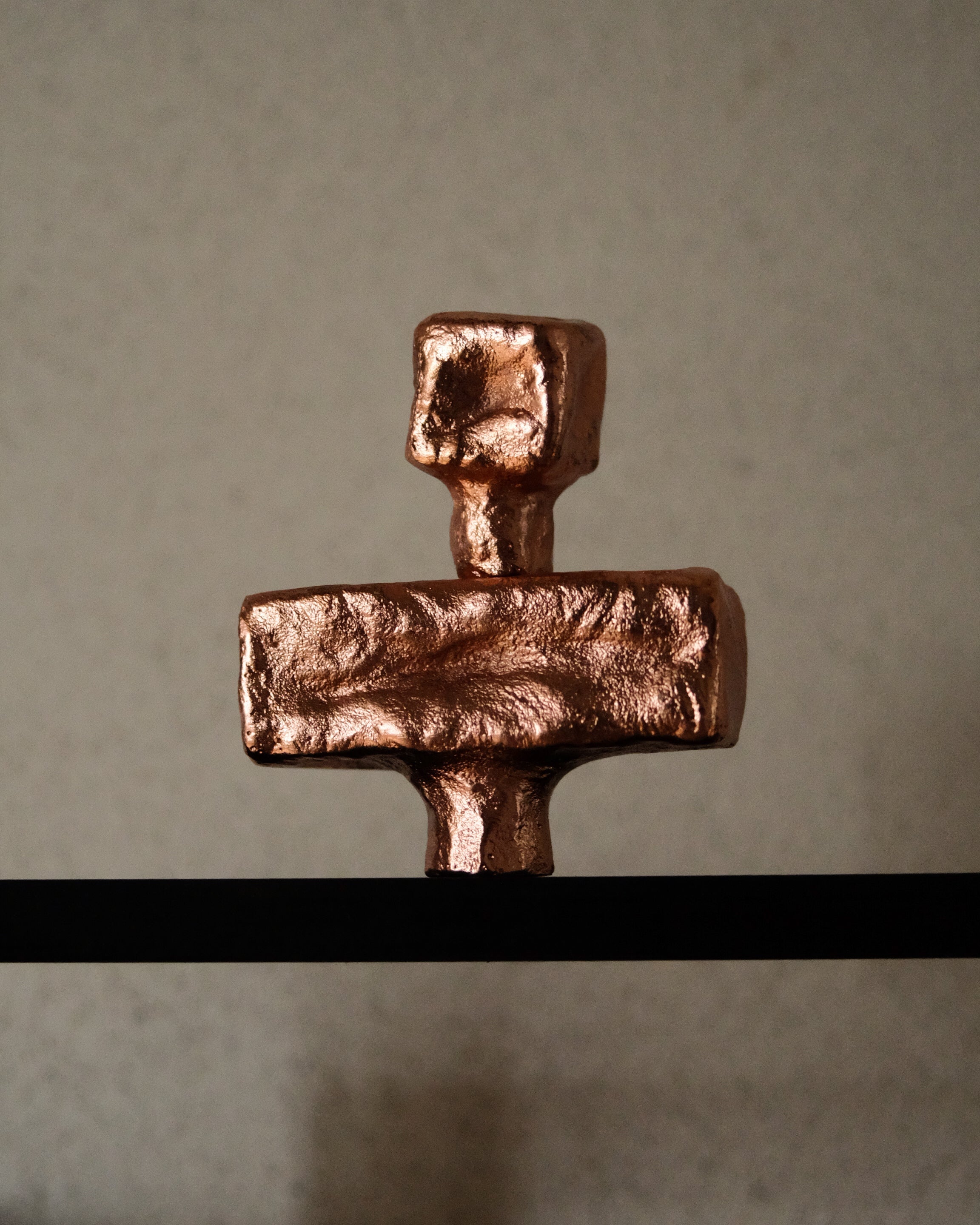 ISLE Cabinet Knob/Wall Hook Small — top view of copper finish on shelf