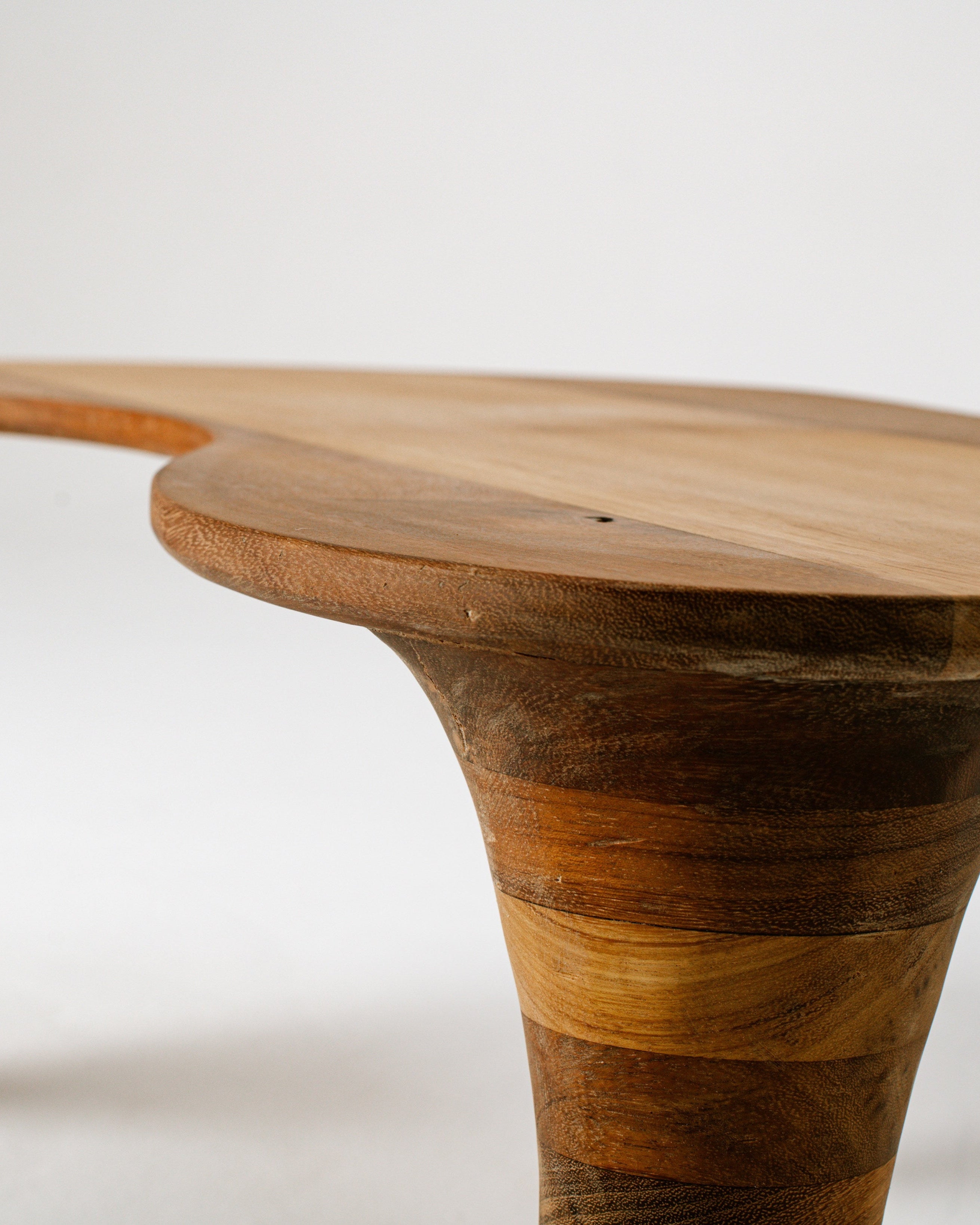 Organic coffee table curved wood leg detail showing natural grain