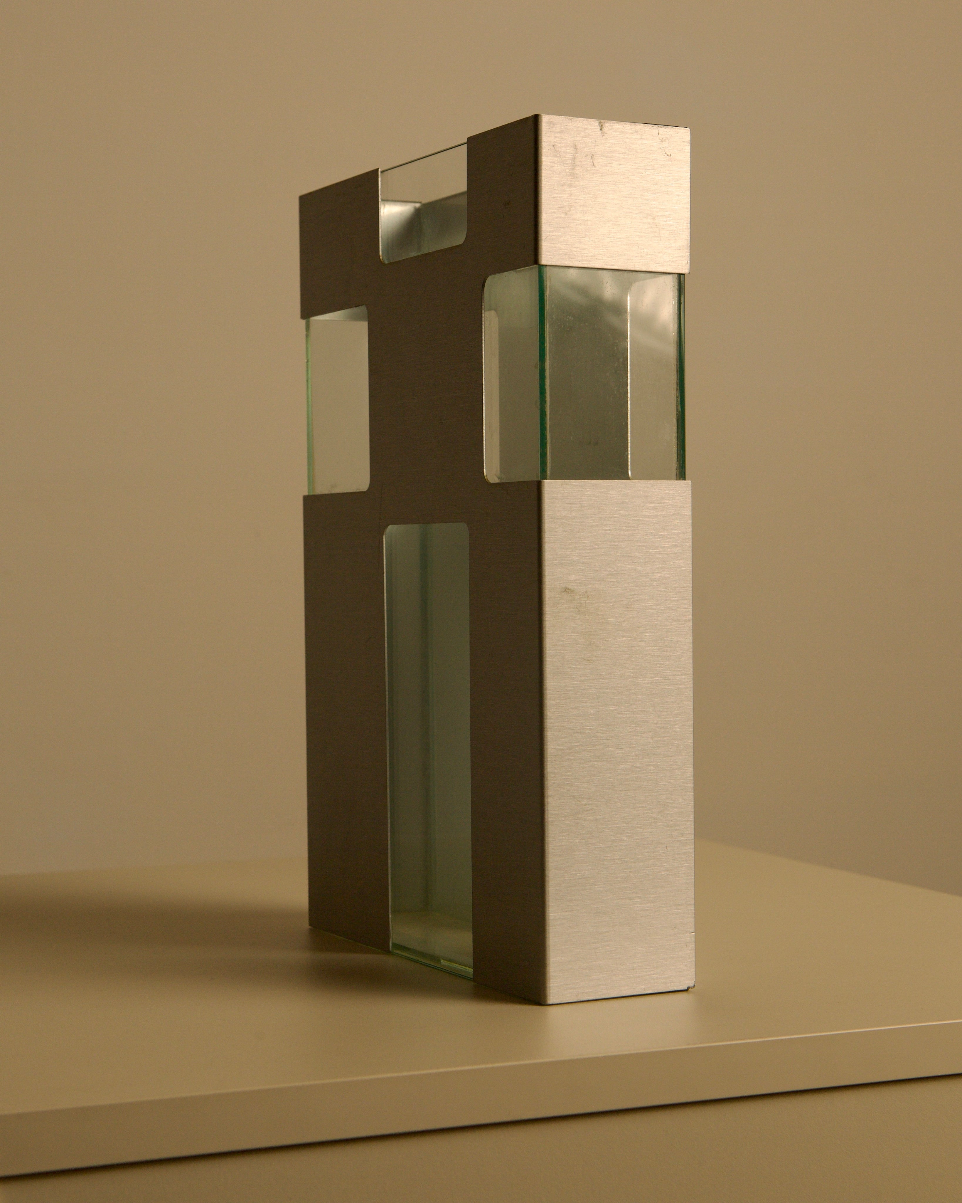 Italian Vase in Metal and Glass c. 1980 — angled view on neutral surface