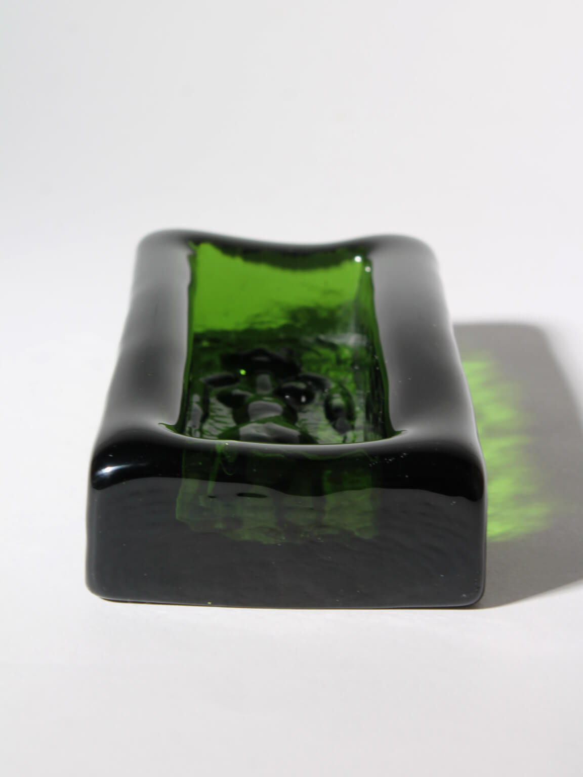 Erik Höglund Nude Female Relief Art Glass Bowl — side view highlighting green glass material
