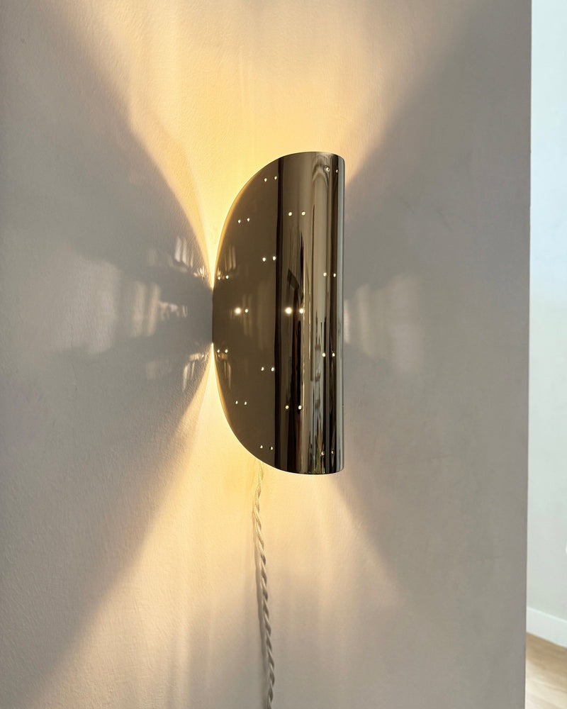 Giselle Wall Lamp - Polished Brass — close-up of polished brass finish on wall