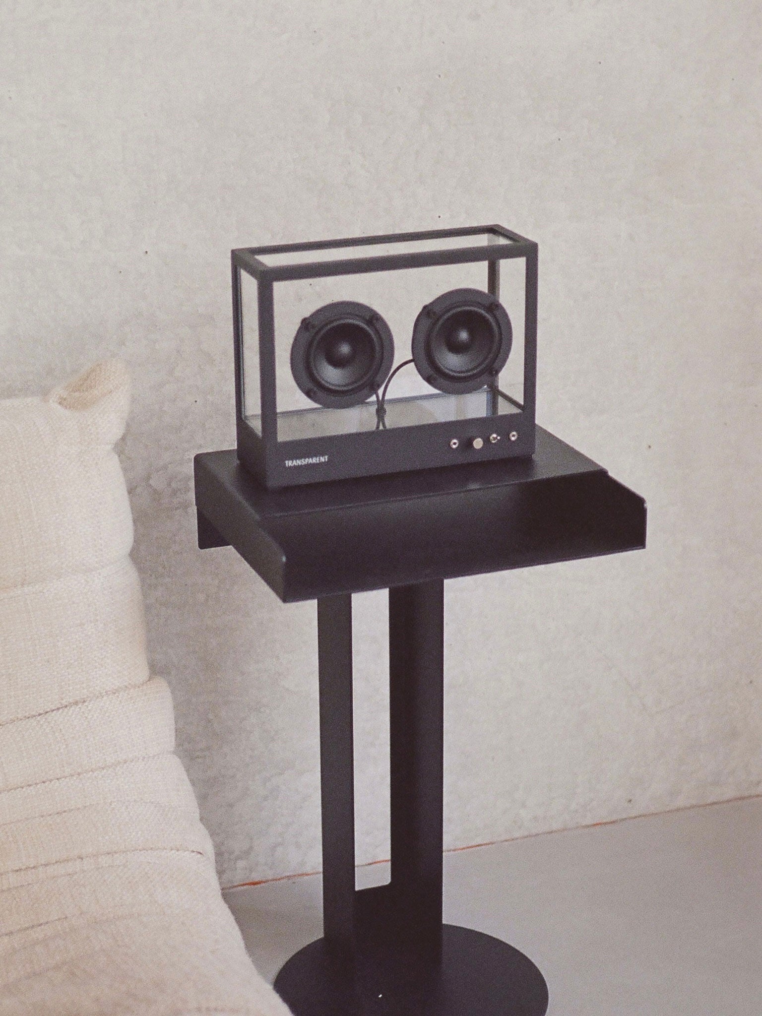 Small Transparent Speaker Black - Bluetooth — side view on black table