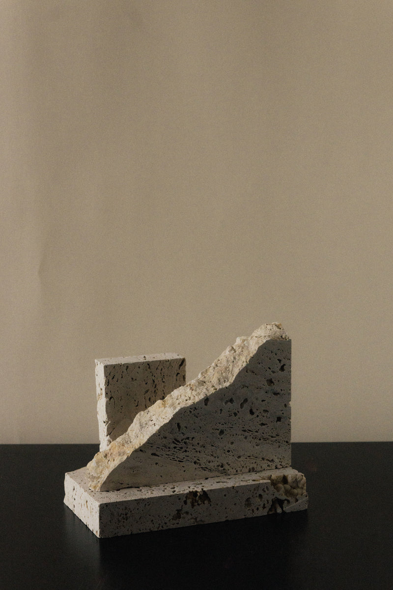 Monument I - Handmade Travertine Marble Bookstand — close-up of textured travertine surface