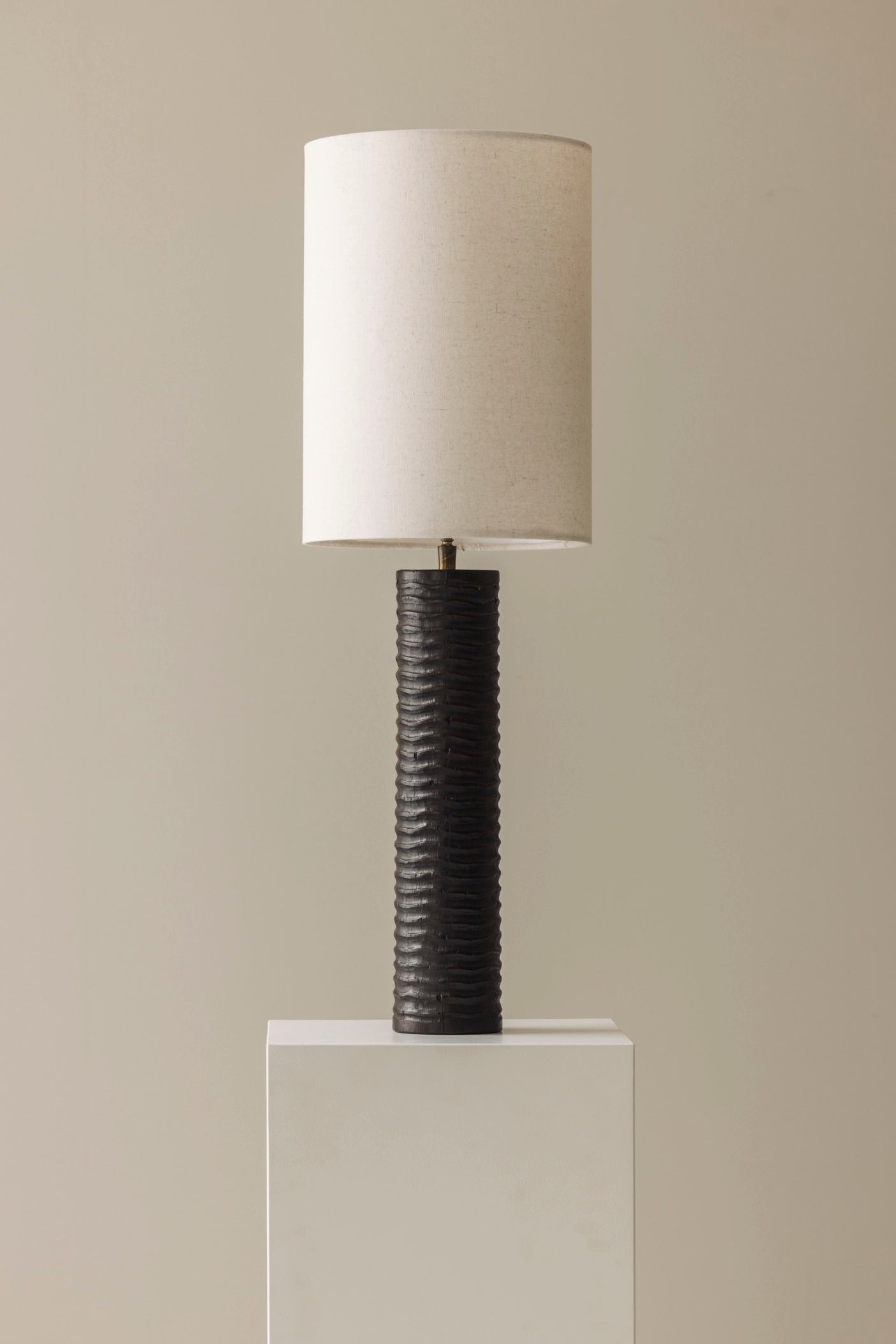 Elegant pair of French wooden carved table lamps from the 1970s. — side angle